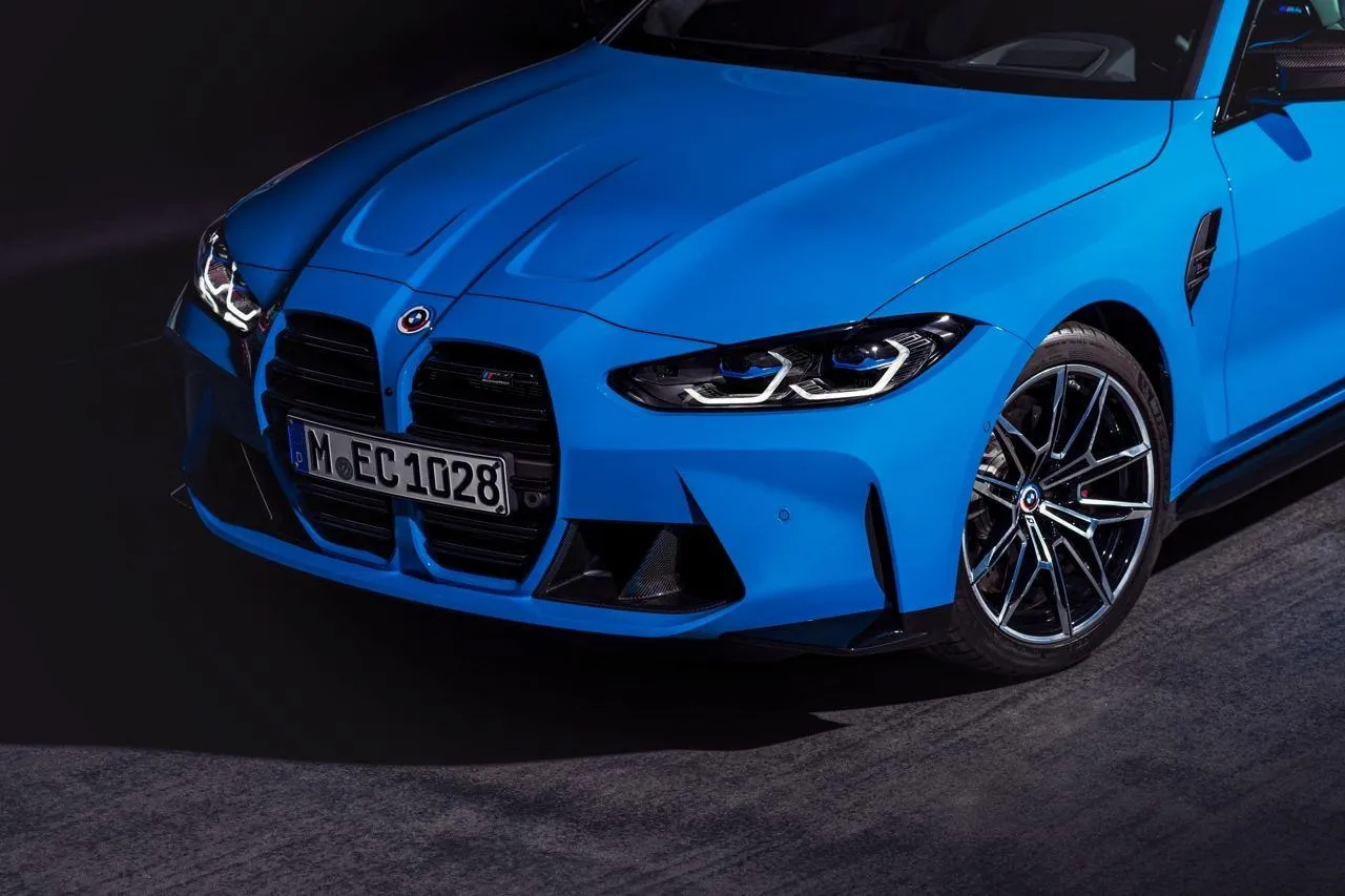 Blue Bmw Sports Car Parked on Asphalt with Headlights