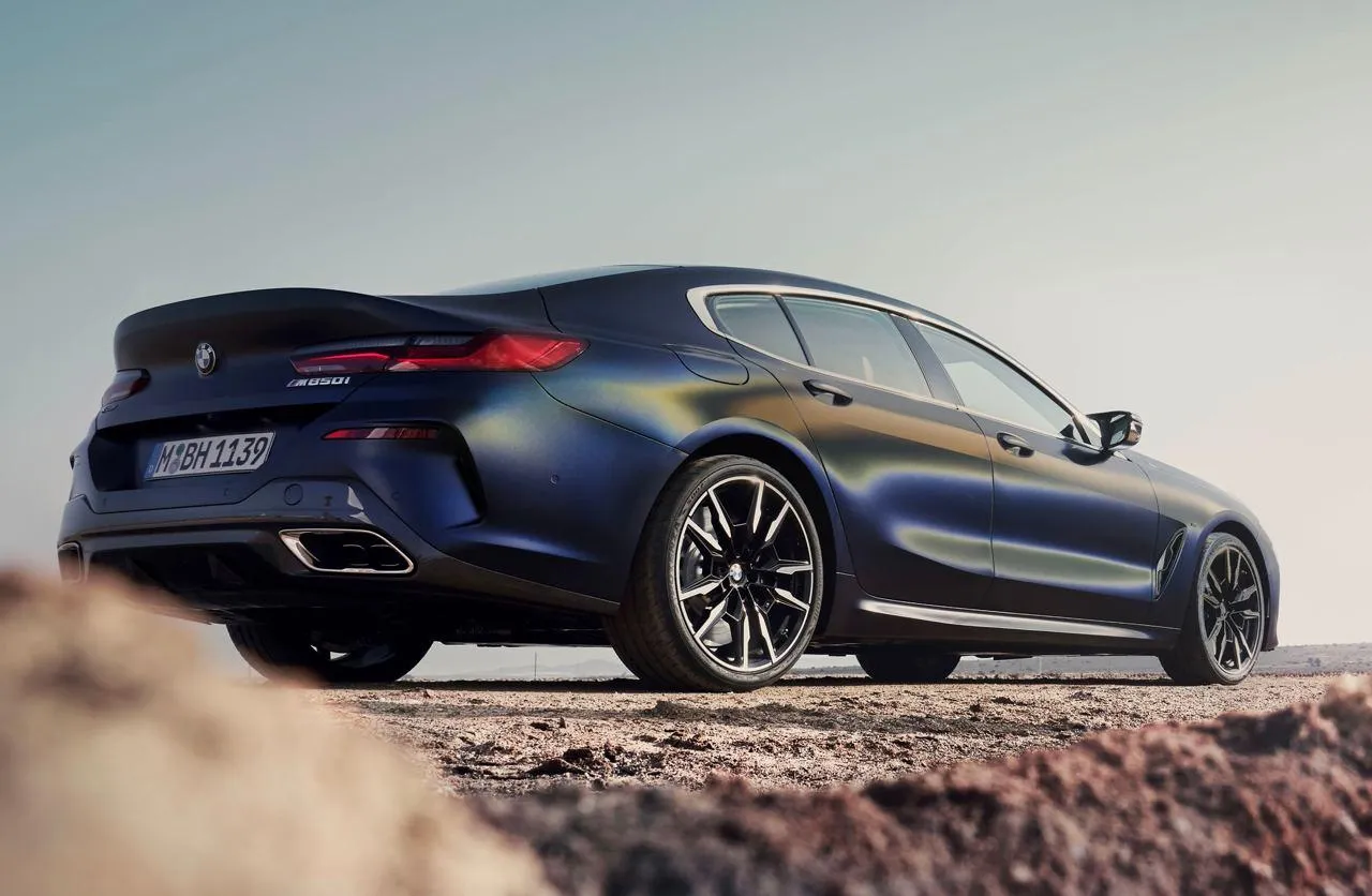 Blue Bmw Sports Car Parked on Rocky Terrain Hd Image