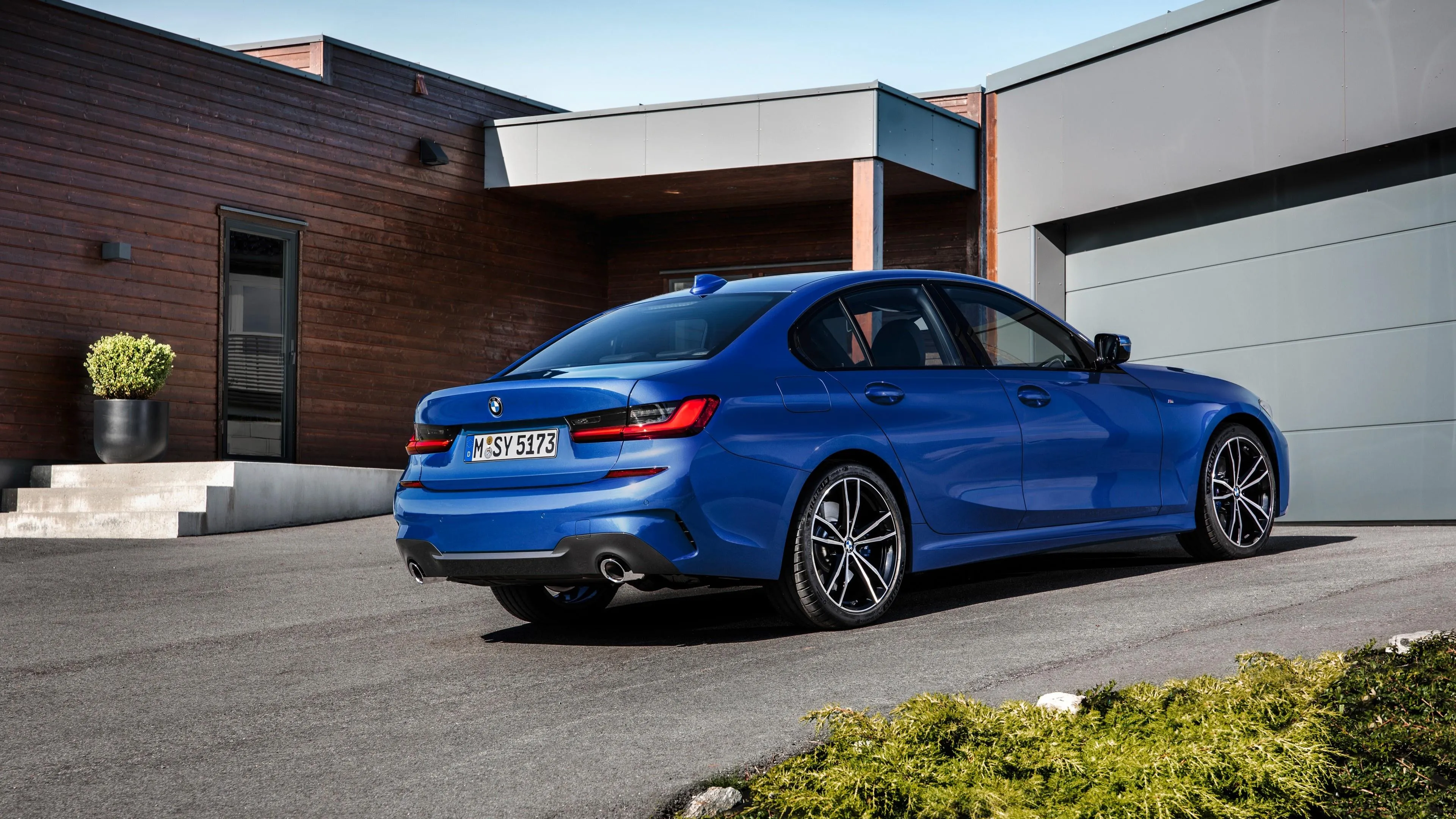 Blue Bmw Station Wagon Parked in Front of Modern House