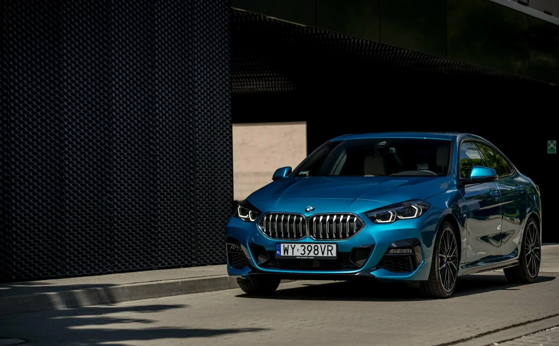 Blue Bmw Suv Driving From Dark Tunnel Into Daylight Hd