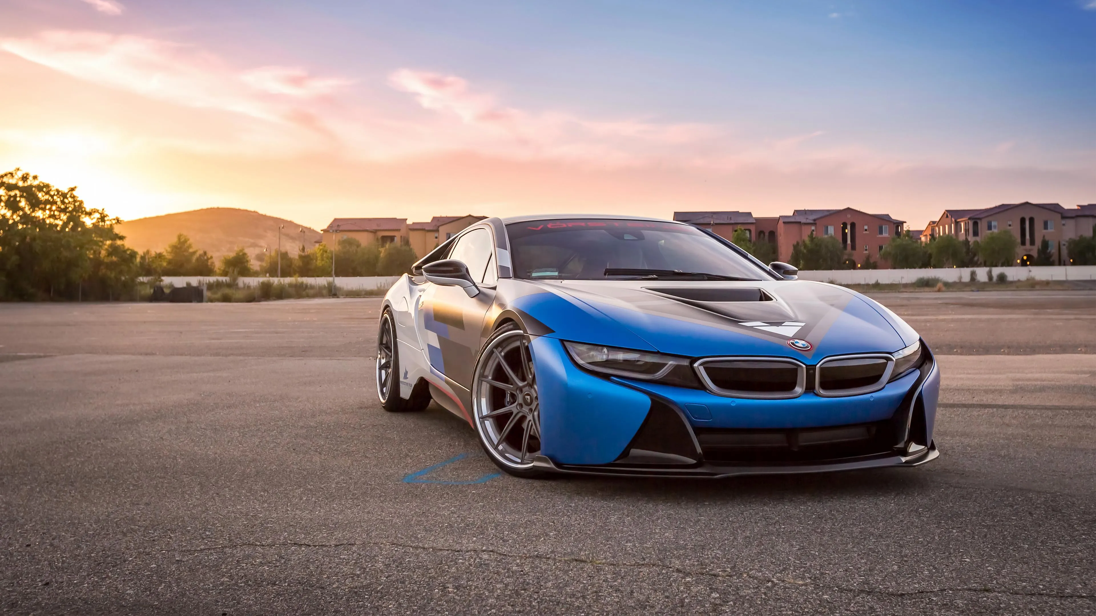 Blue Futuristic Bmw I8 Parked on Race Track at Sunset