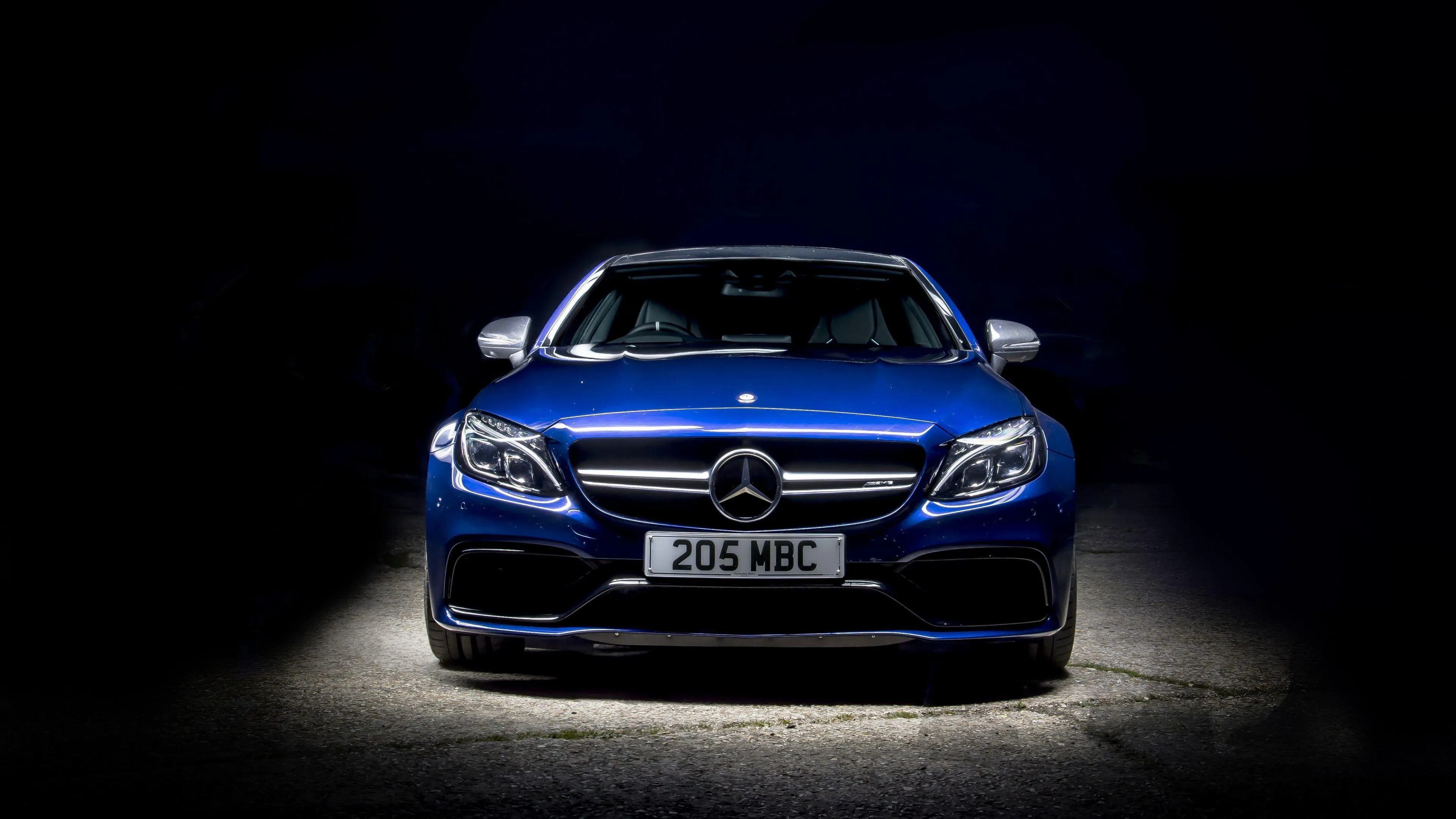 Blue Mercedes Benz Car Front View in Dark Environment