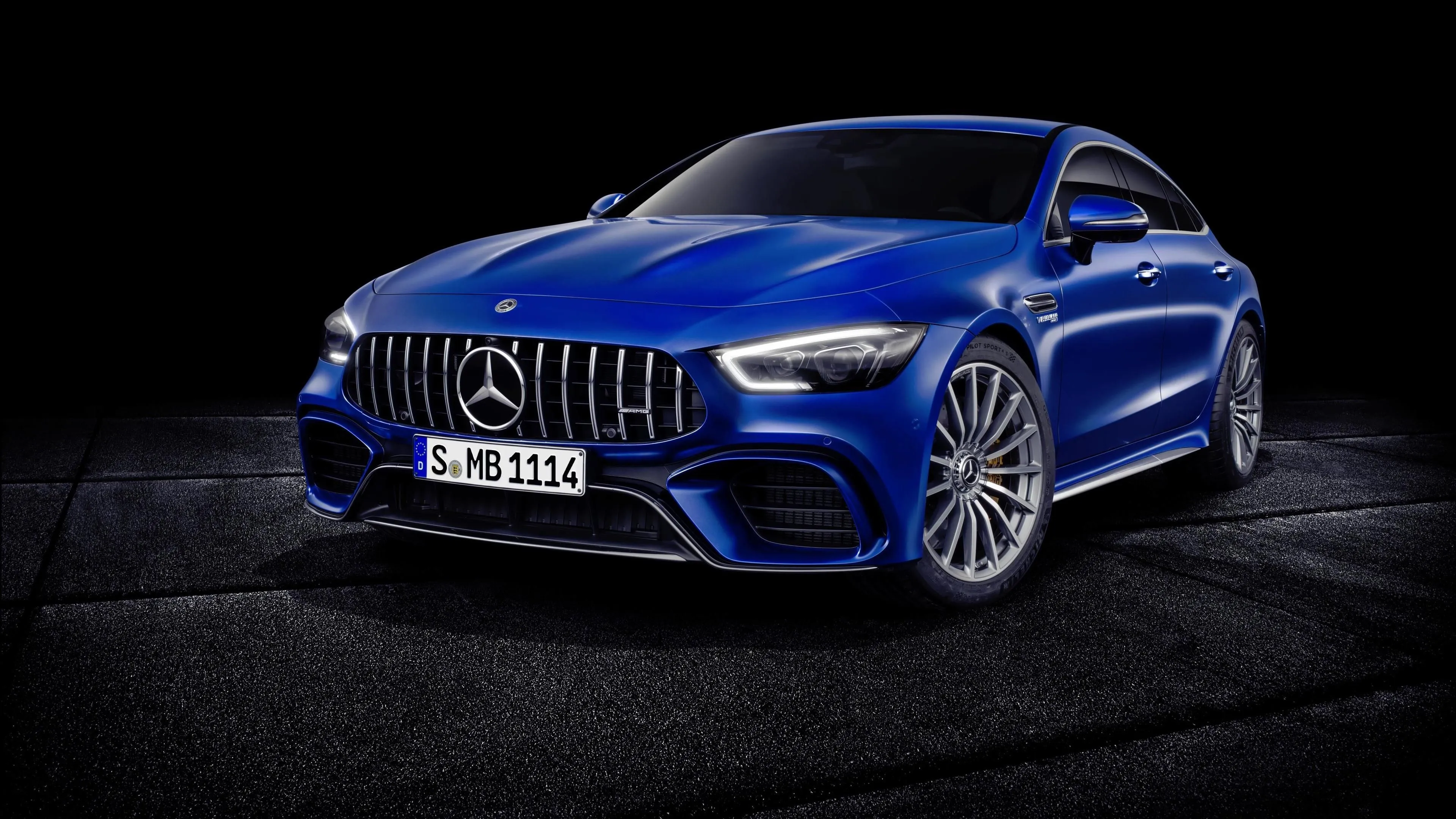 Blue Mercedes Benz Sports Car Highlighted in Dark Wallpaper