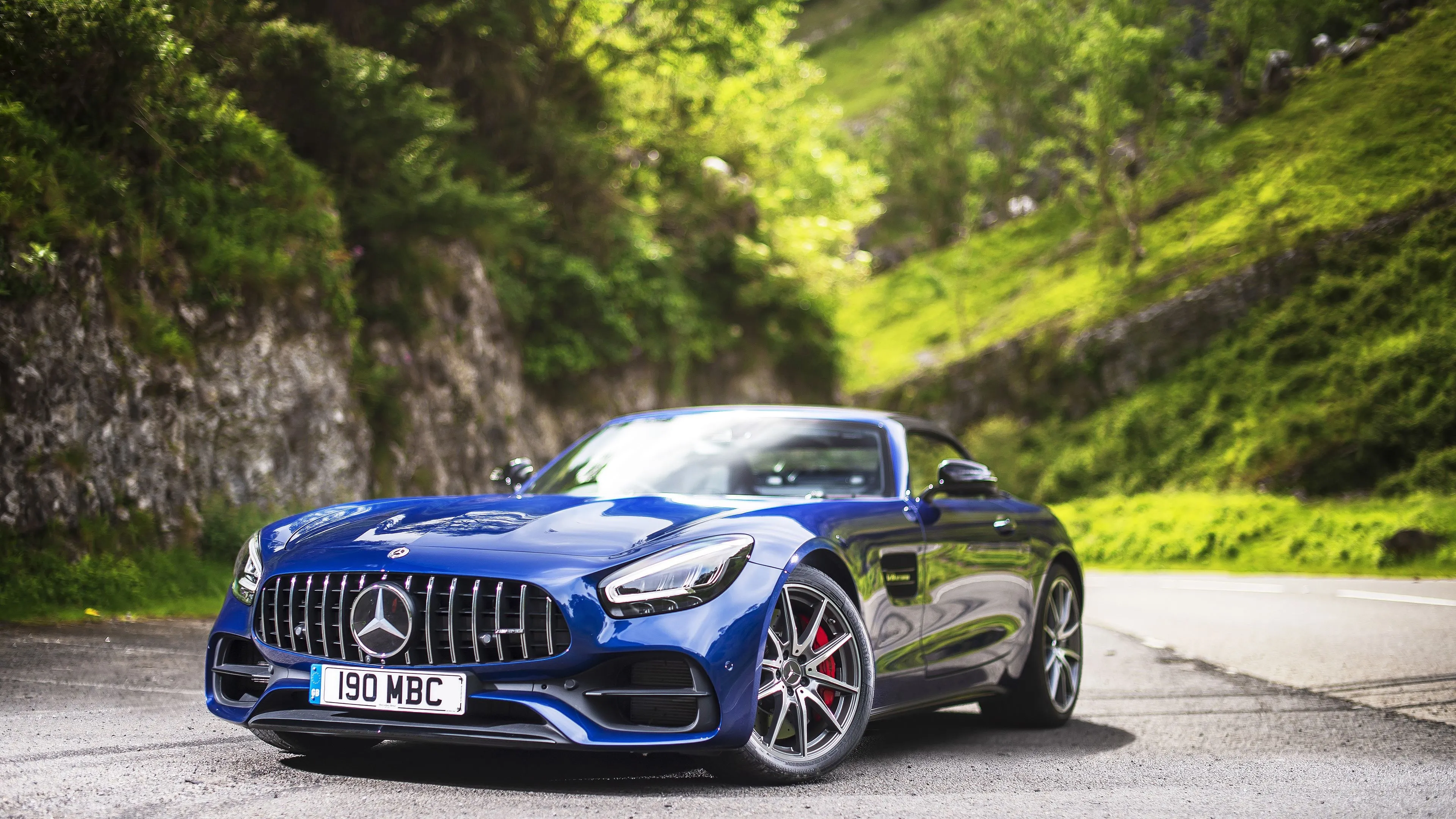 Blue Mercedes Benz Sports Car Parked on Mountain Road