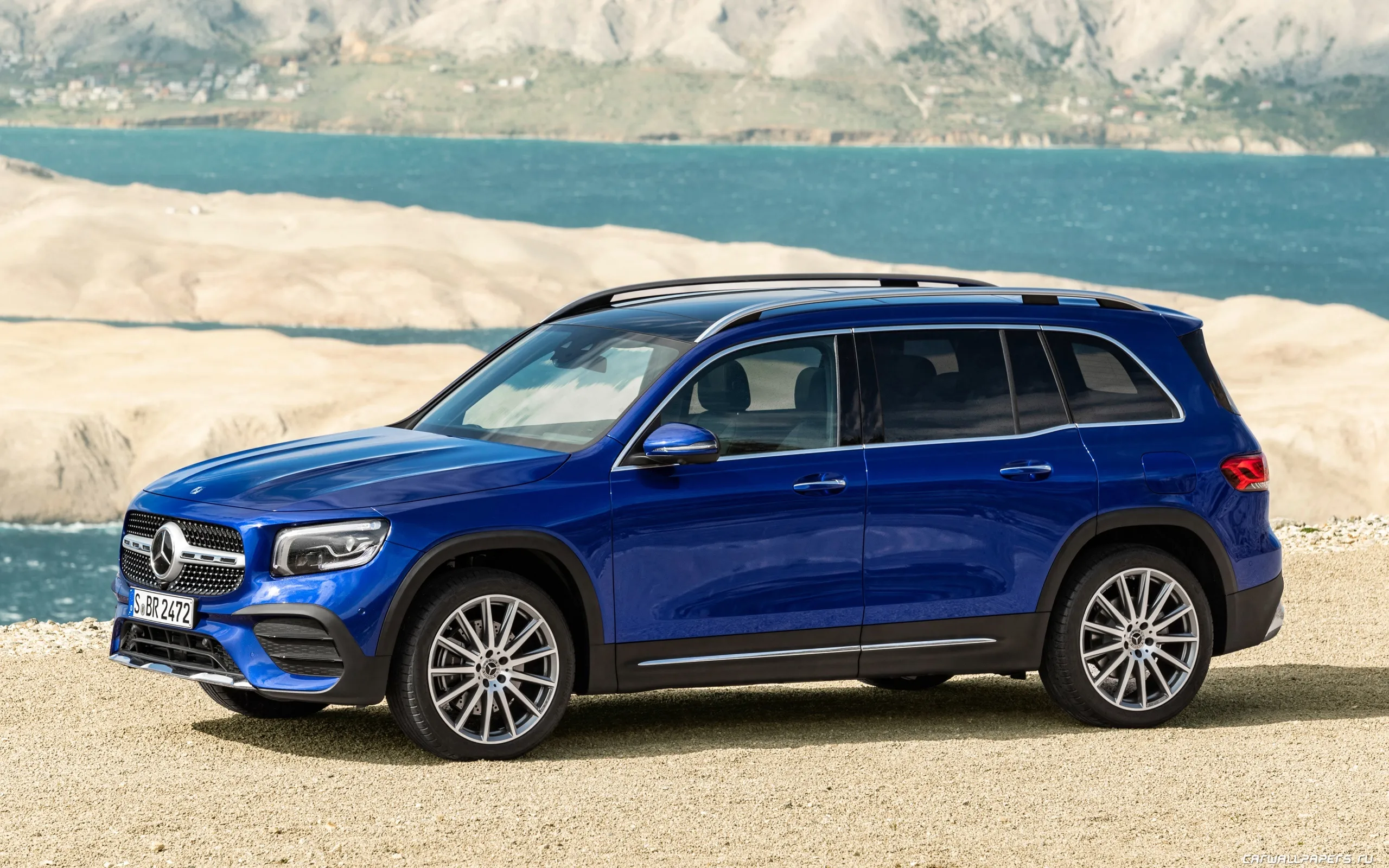 Blue Mercedes Benz SUV Parked on Sandy Desert Terrain