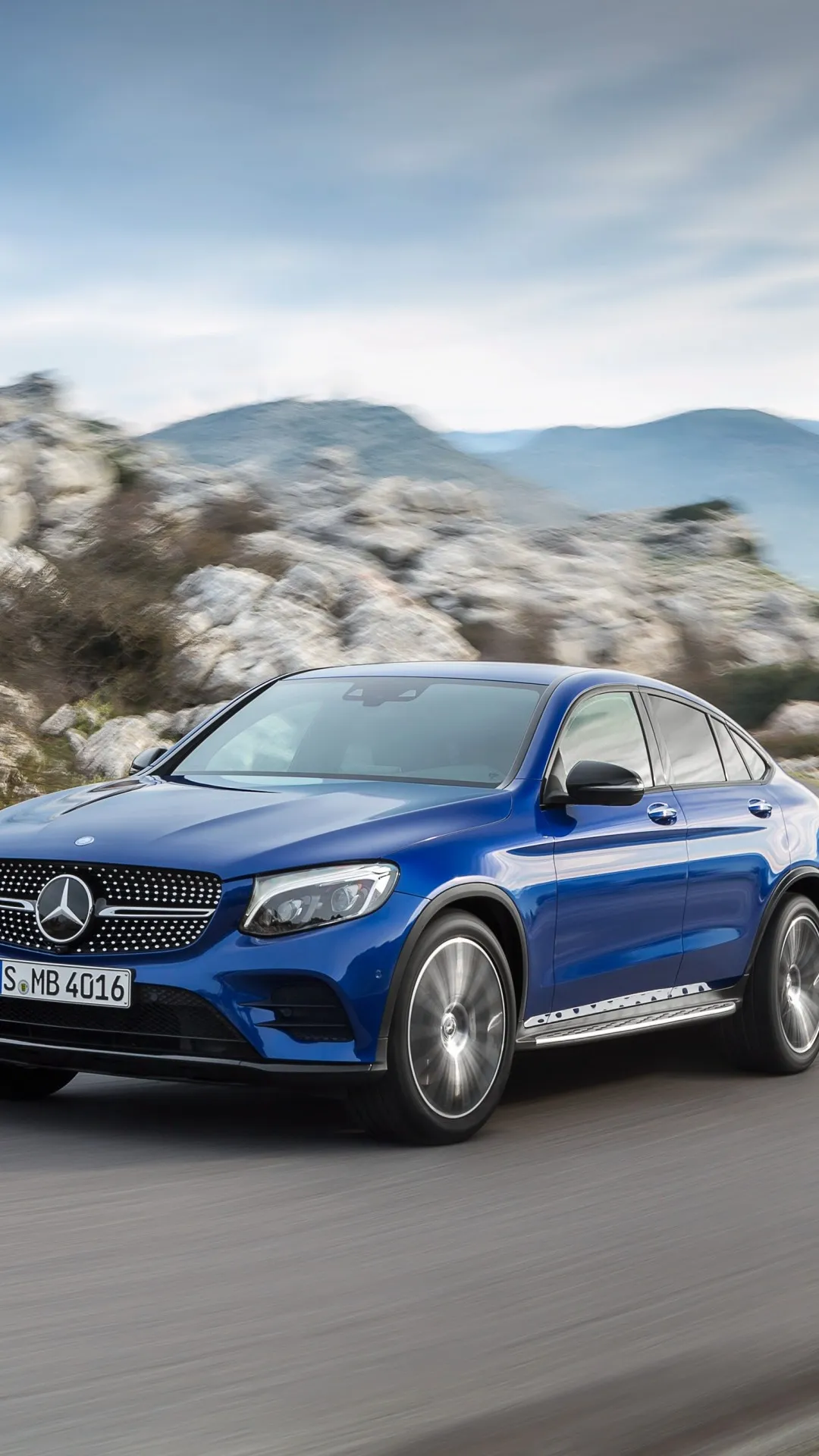 Blue Mercedes SUV Navigating Rocky Terrain Wallpaper 4K