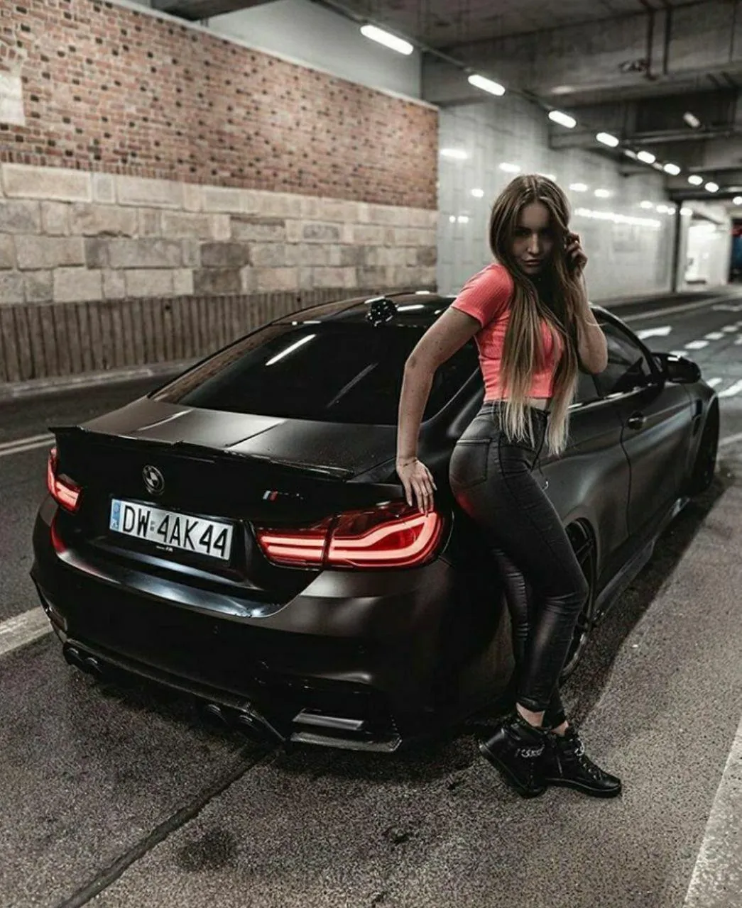 Bmw 4 Series Parked Indoors with a Person Nearby Image