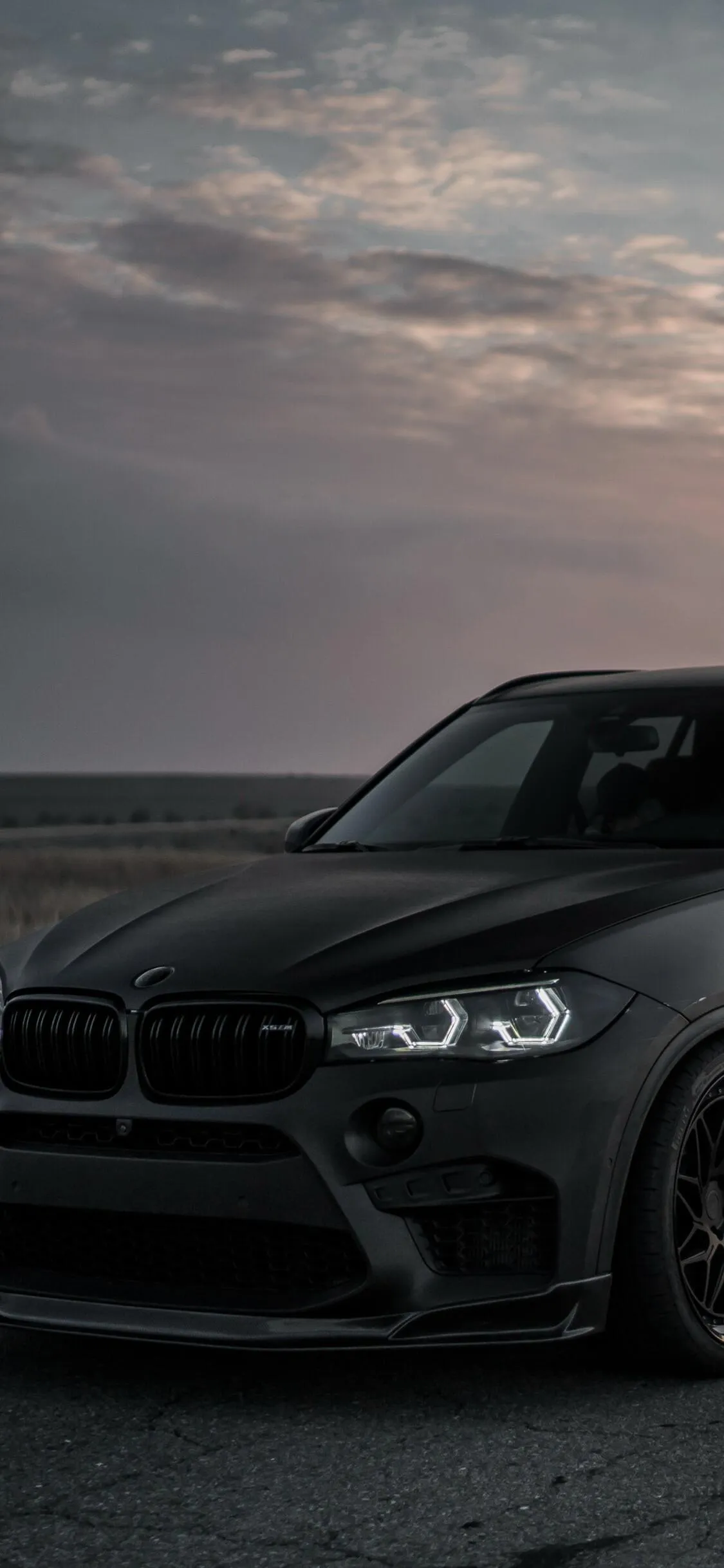 Bmw Black Car Parked By the Water at Sunset Time Wallpaper