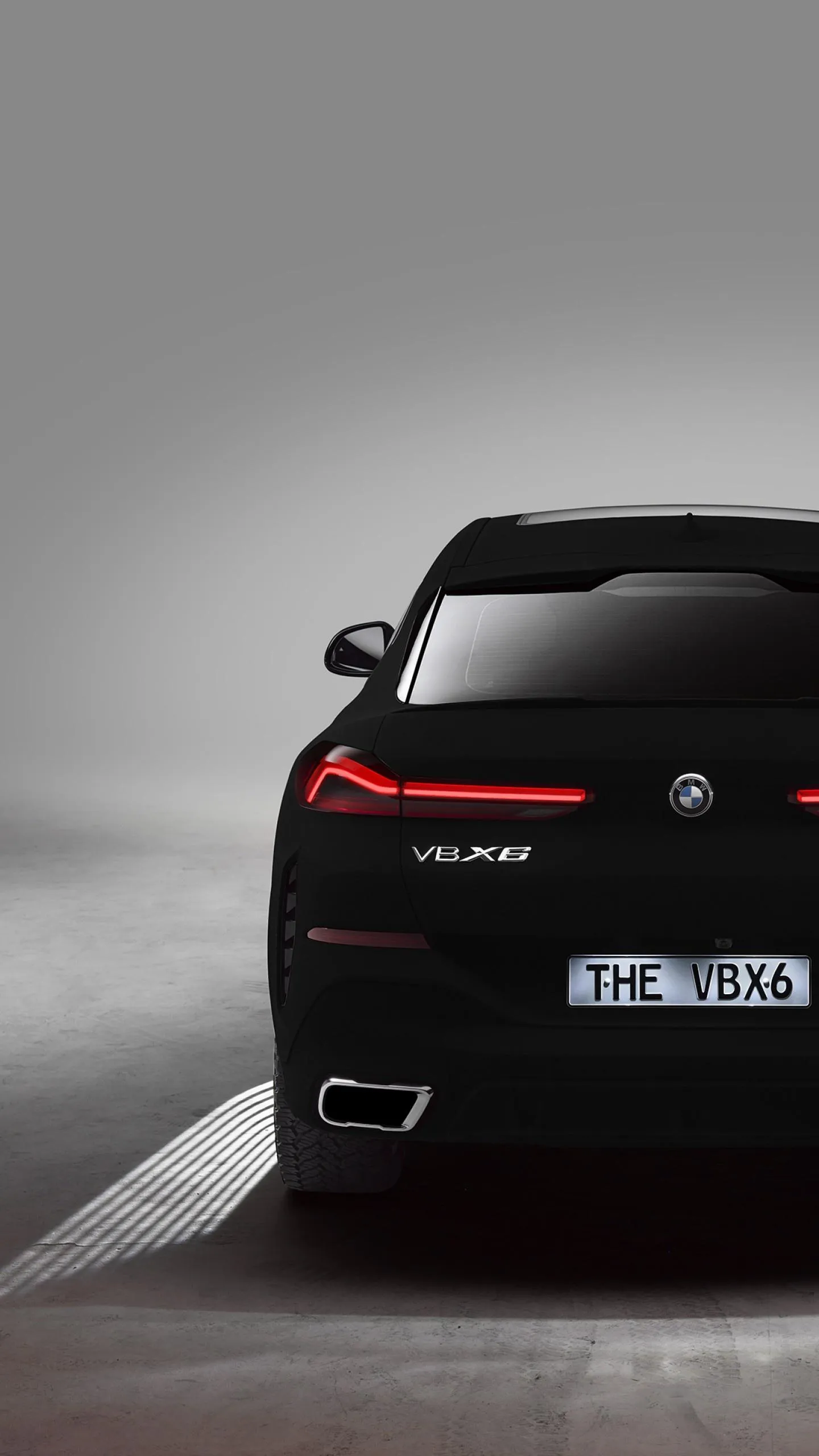 Bmw Black Car Rear View Driving on Dark Roadway Wallpaper