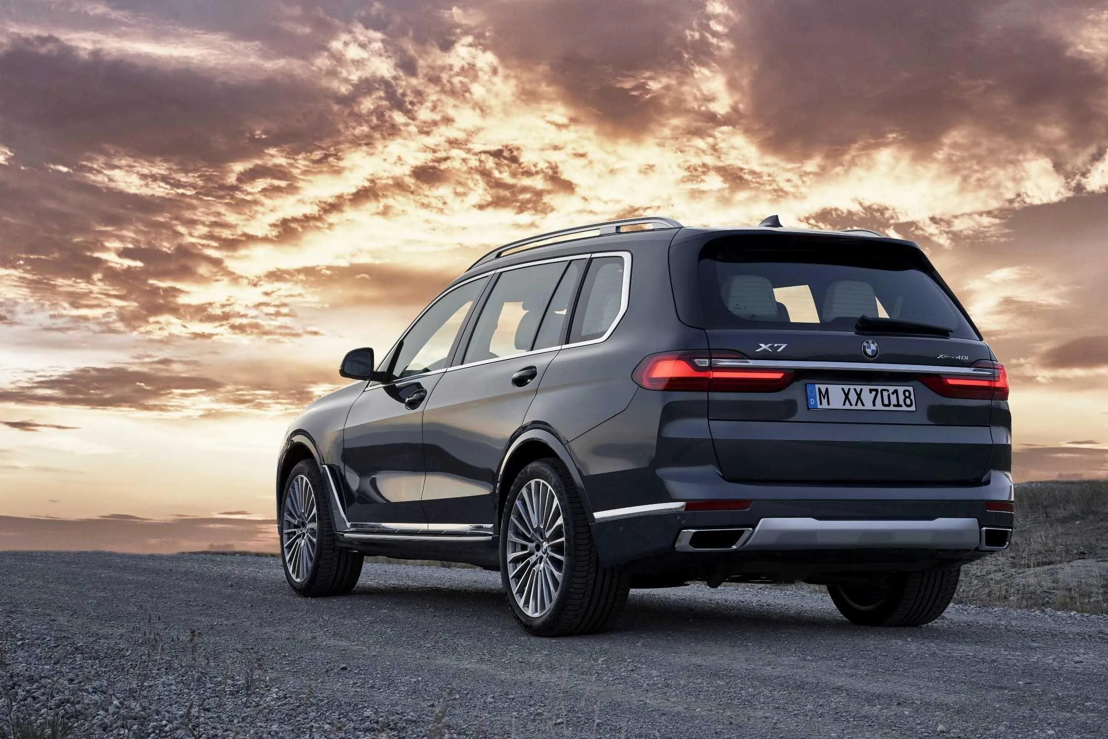 Bmw Black Suv Parked at Sunset with Dramatic Sky View