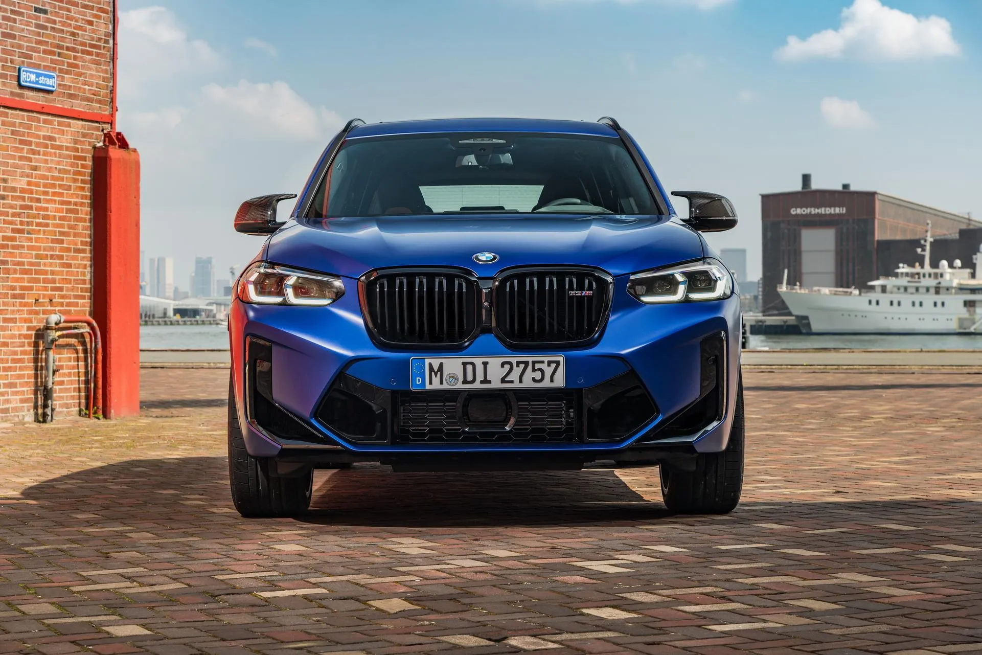 Bmw Blue Suv Parked in Urban Setting with Clear Sky