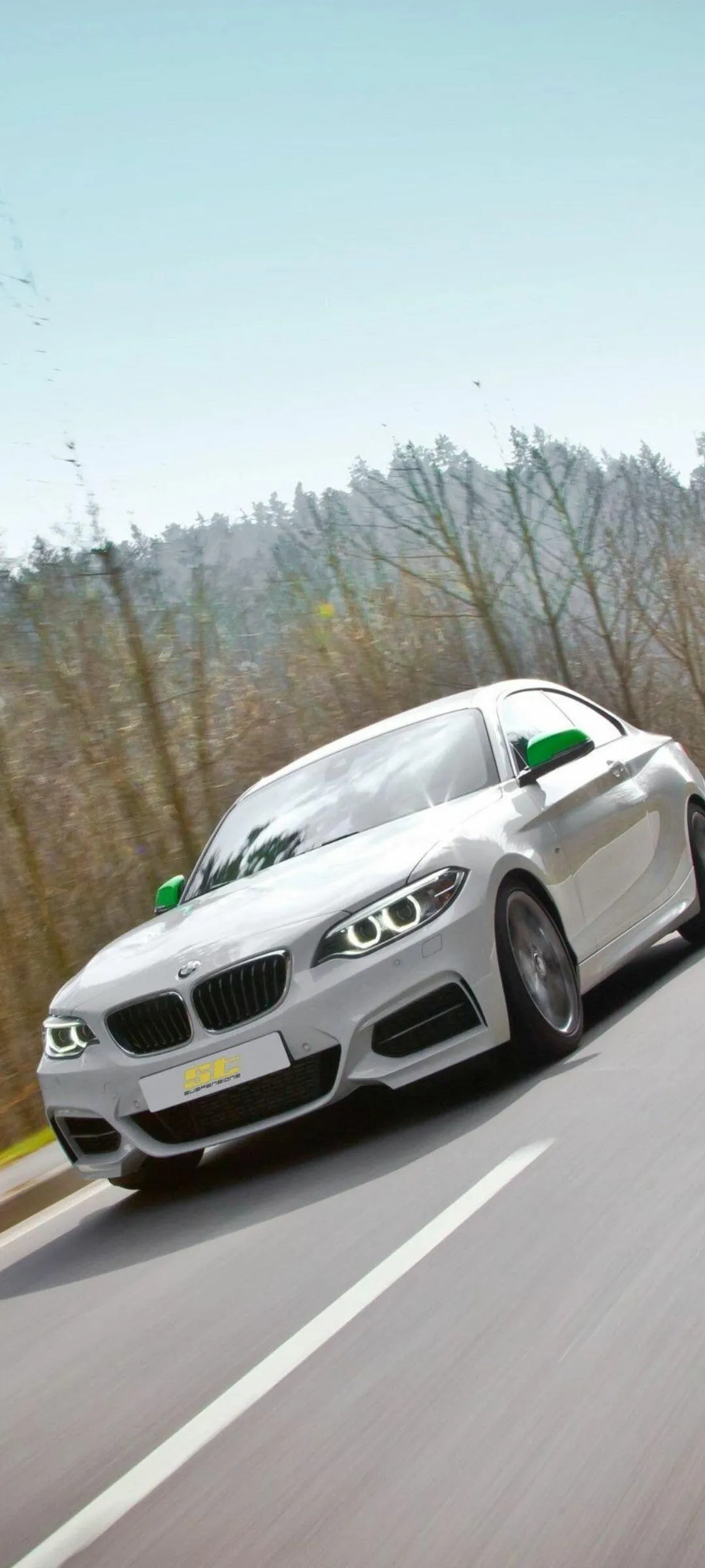 Bmw Car Driving on Mountain Road with Clear Sky Wallpaper