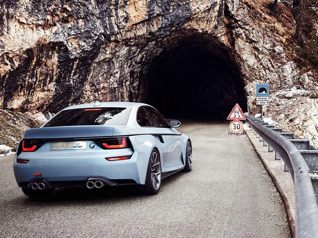 Bmw Car Entering Rocky Tunnel on Scenic Mountain Road