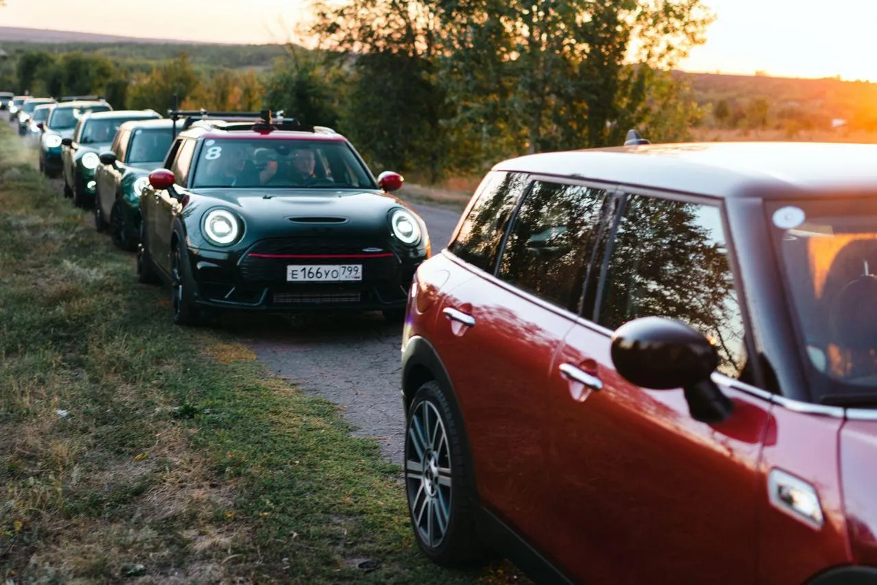 Bmw Car in a Line with Colorful Compact Vehicles Wallpaper