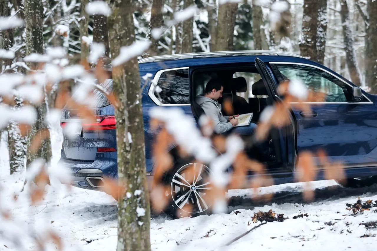 Bmw Car in Snowy Environment with Winter Vibes Wallpaper