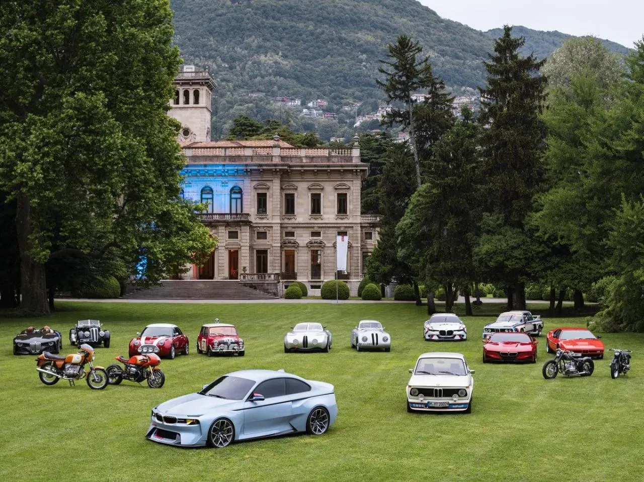 Bmw Car Lineup Displayed on Lawn in Front of Mansion