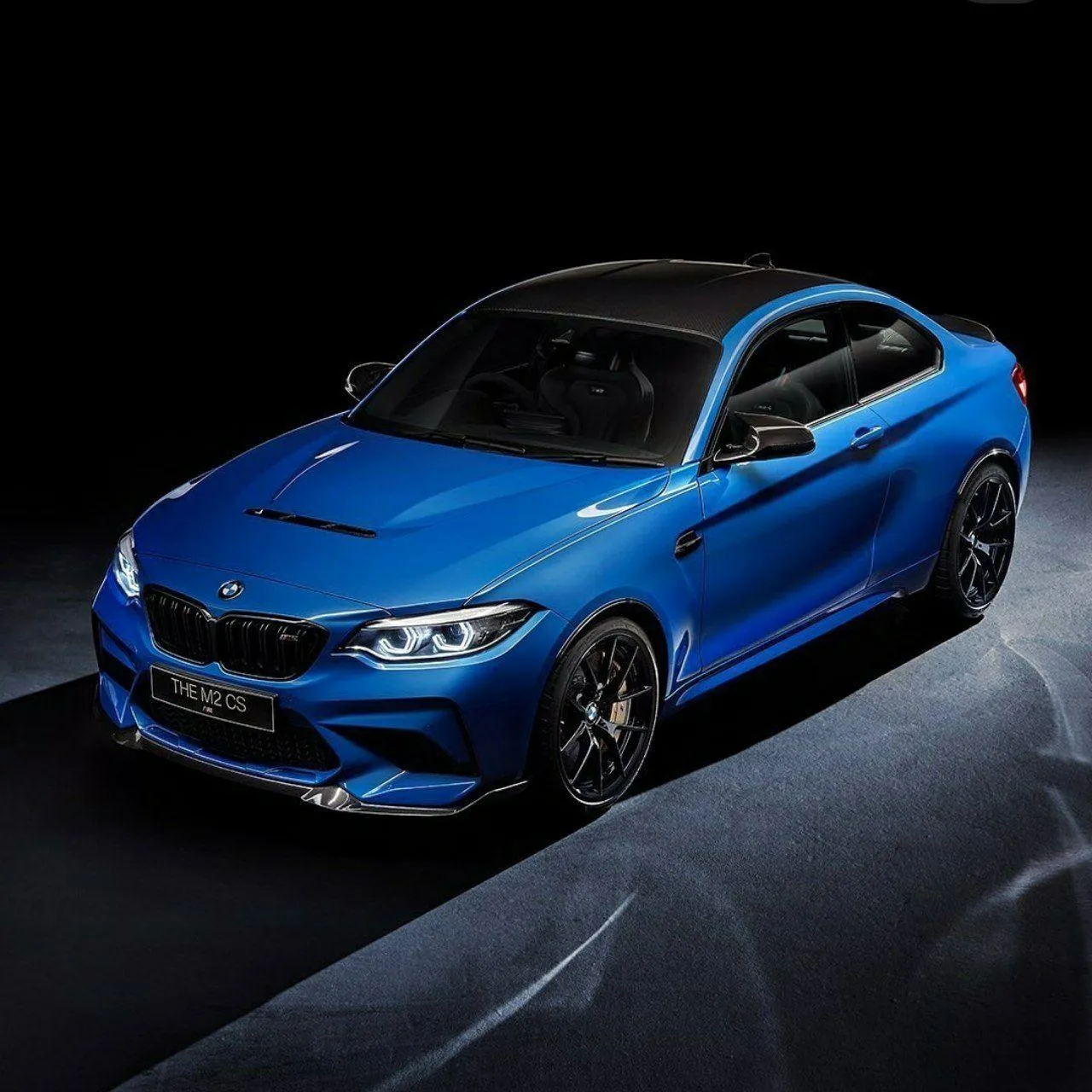 Bmw Car Model in Bright Blue Color on a Rainy Street