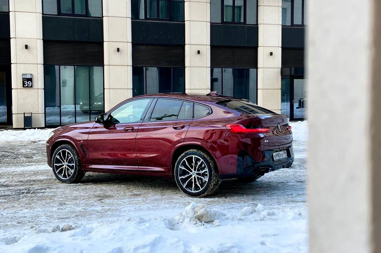 Bmw Car Parked in a Snowy Urban Environment Wallpaper