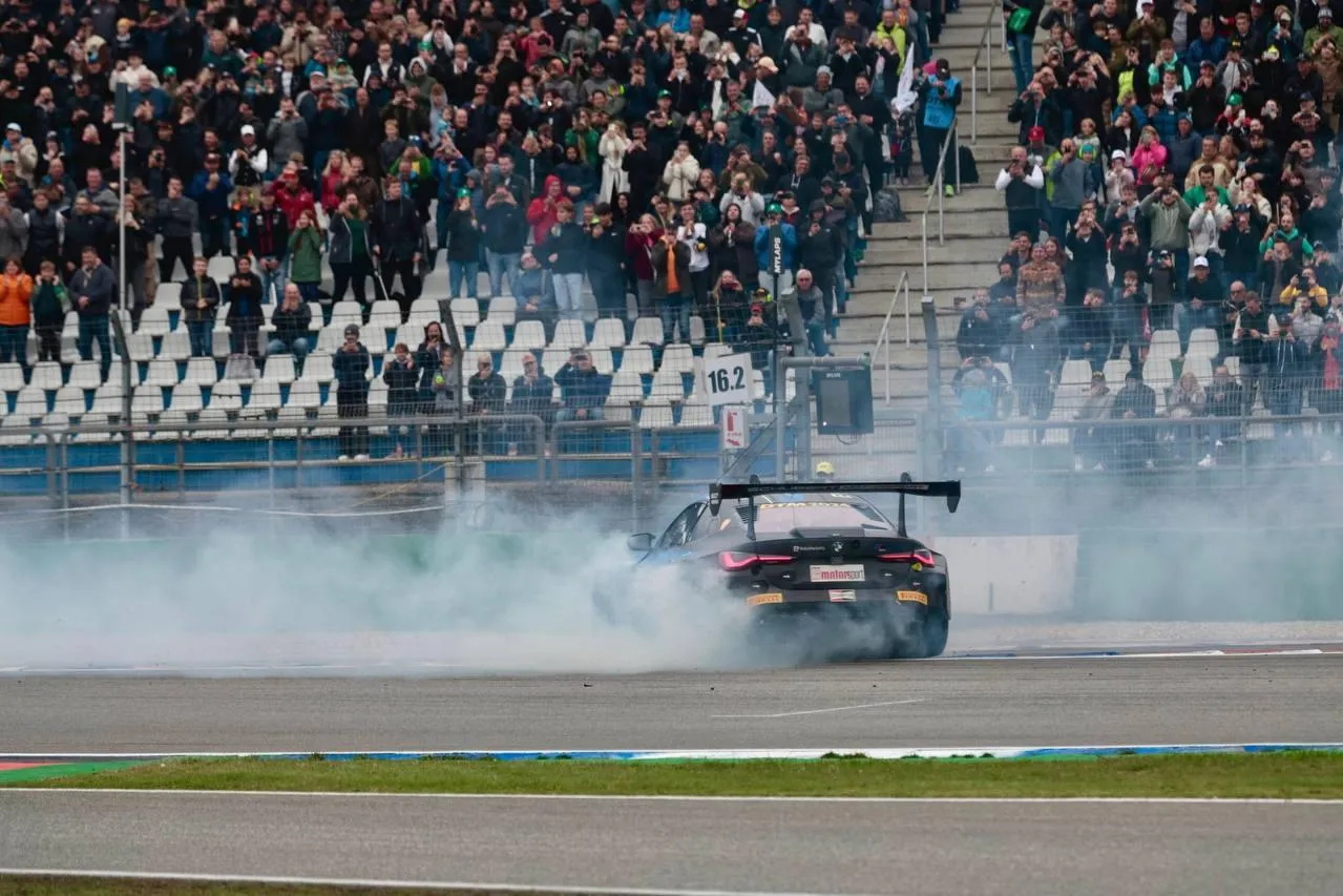 Bmw Car Performing Drift Maneuver in Front of Crowd