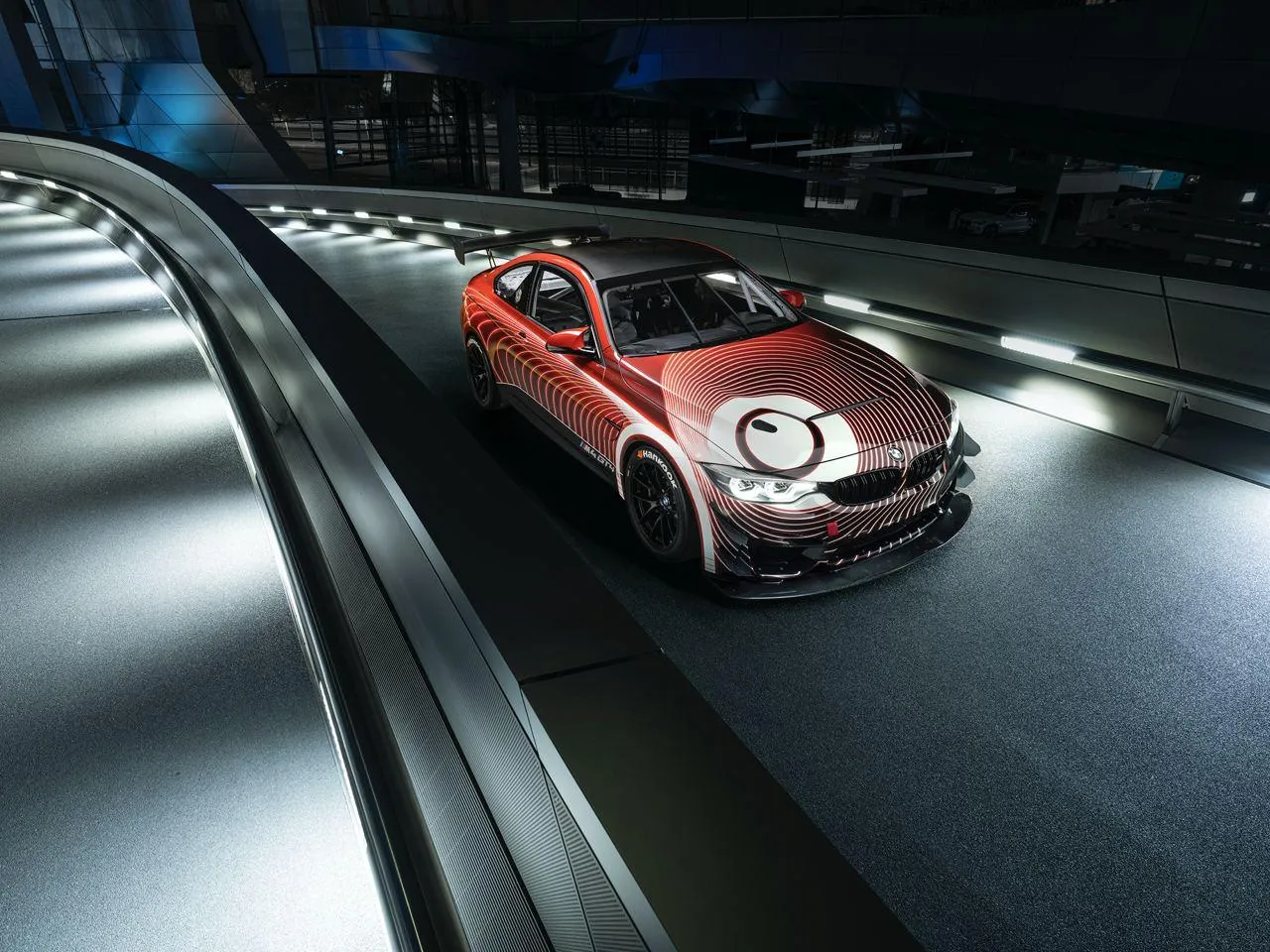 Bmw Car Racing Under the Night Lights on a Race Track