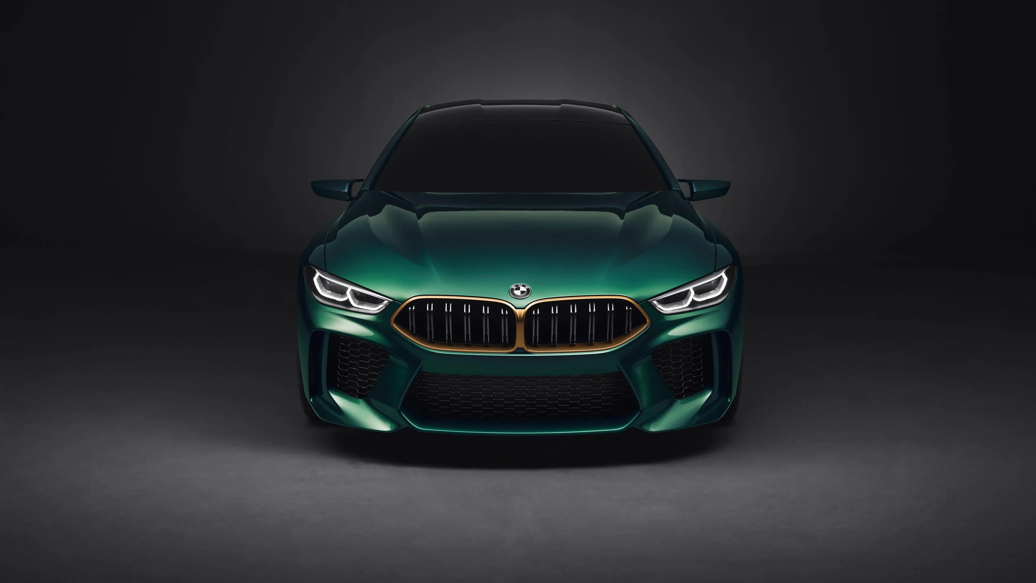 Bmw Car with Green Paint Under Spotlight in the Dark