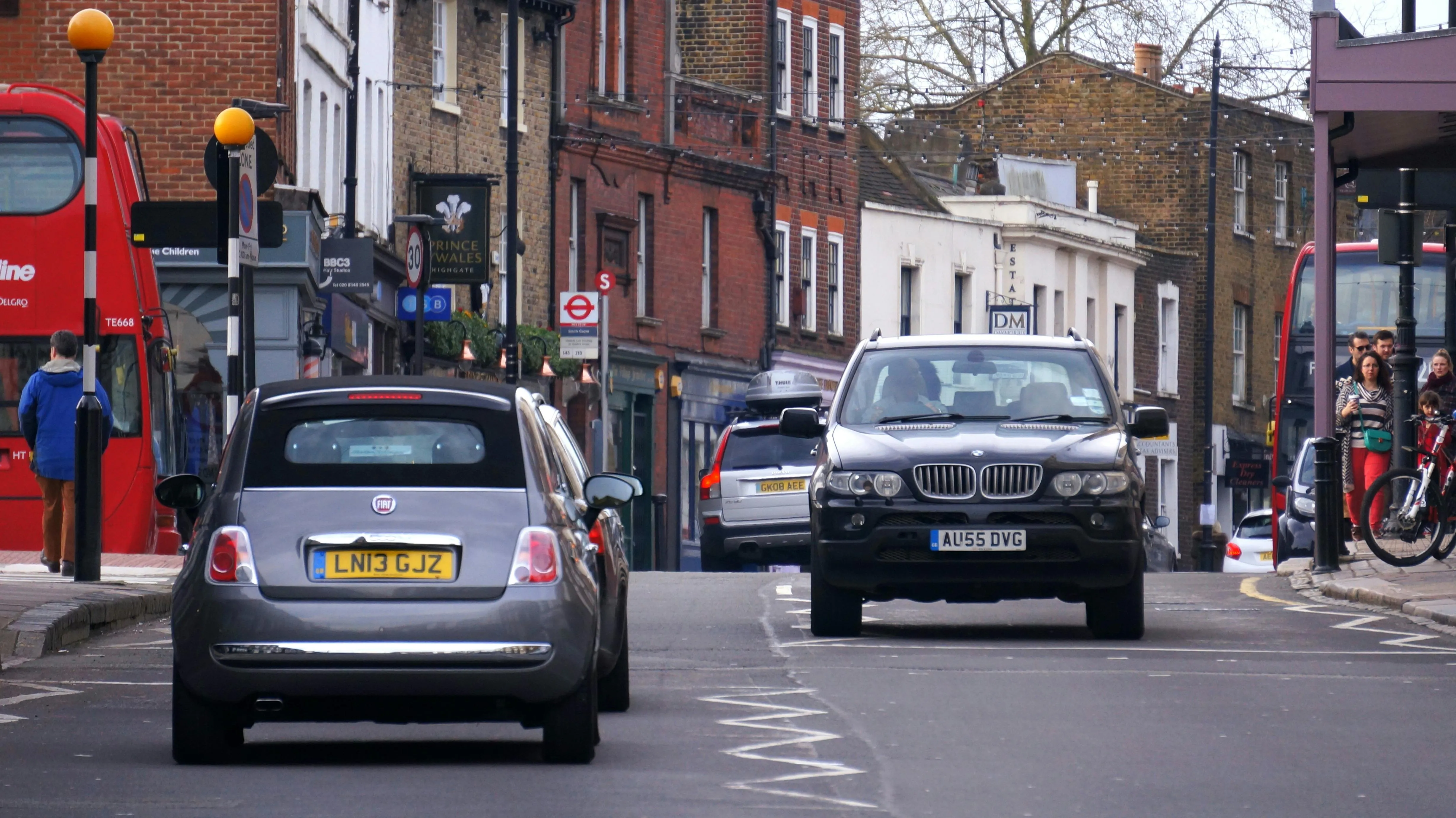 Bmw Cars in City Street Traffic with Pedestrians and Buildings