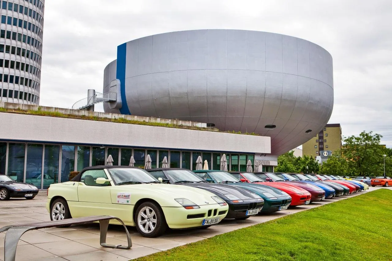 Bmw Cars Lined Up at a Modern Architectural Setting