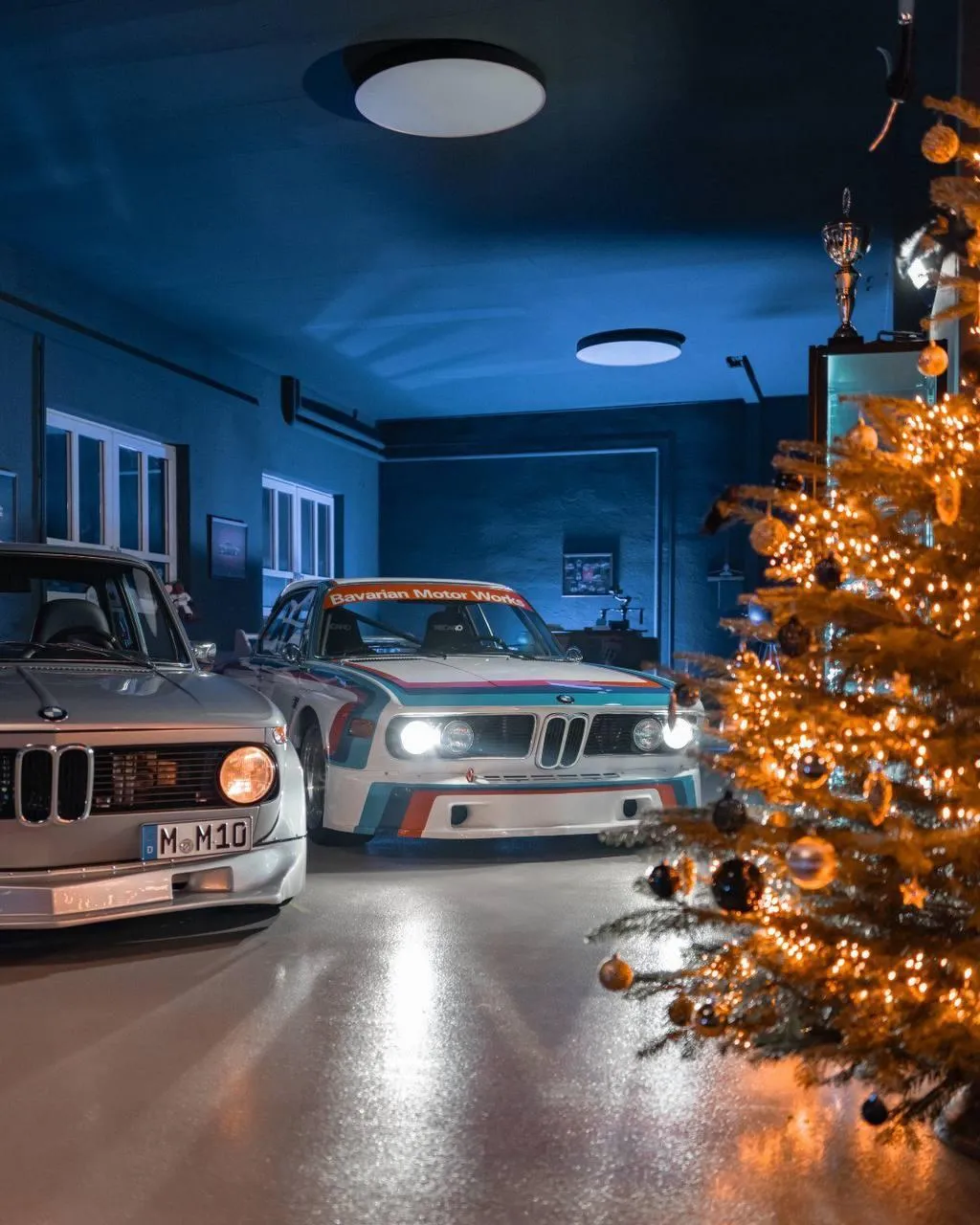 Bmw Cars Parked Inside Room with Christmas Tree Lighting