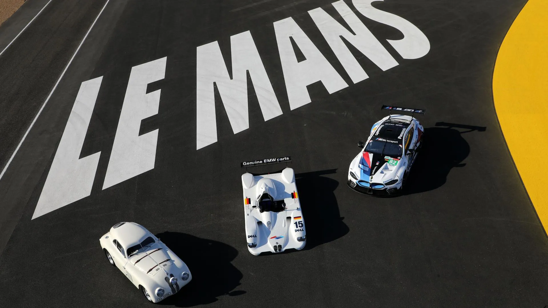 Bmw Cars Placed on a Le Mans Track For a Racing-Themed Shot