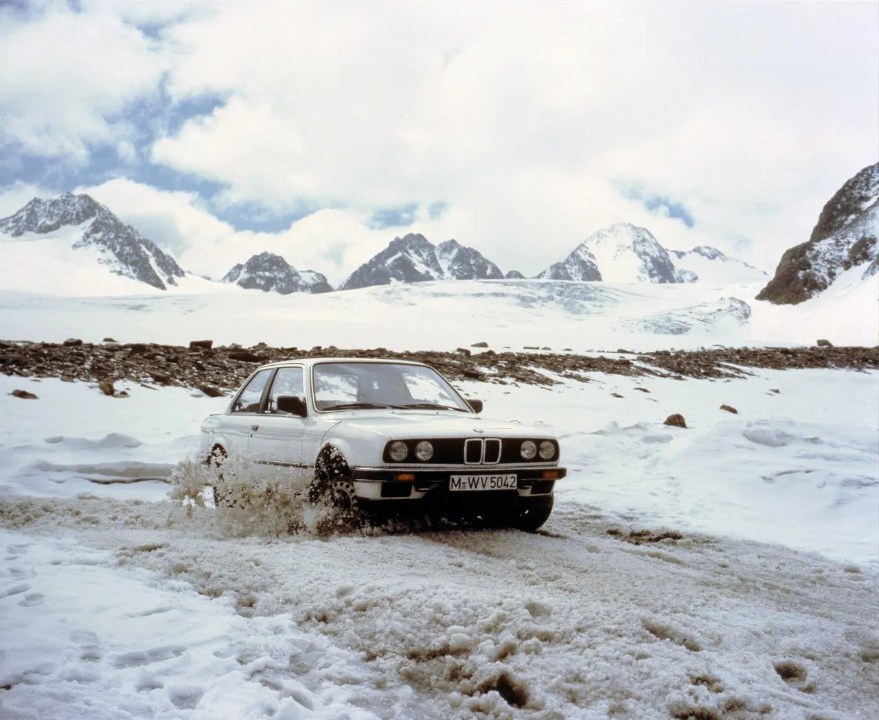 Bmw Classic Car on Snowy Mountain Road with Stunning View