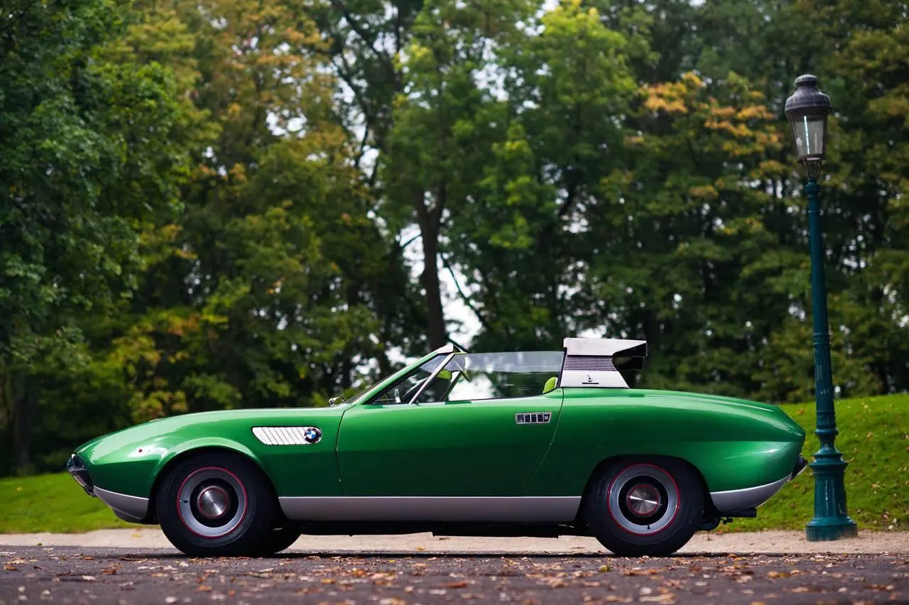 Bmw Classic Green Car Parked on a Scenic Road Wallpaper