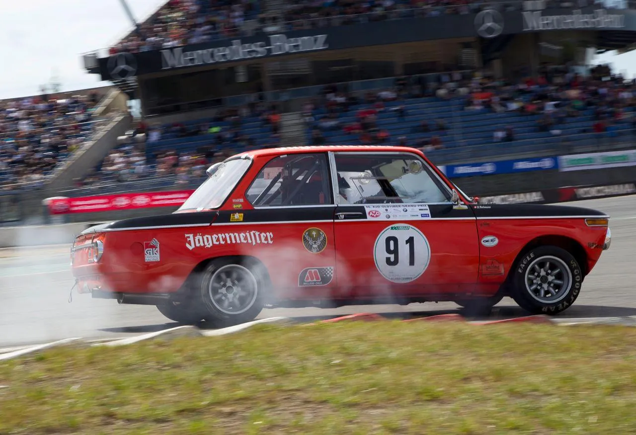 Bmw Classic Racing Car in Action at a Motorsport Event