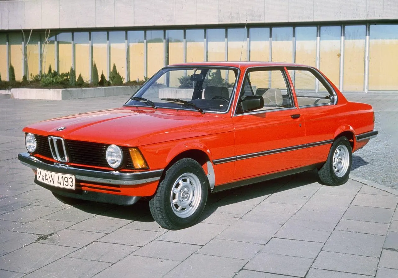 Bmw Classic Red Sedan Parked Outside Near Building