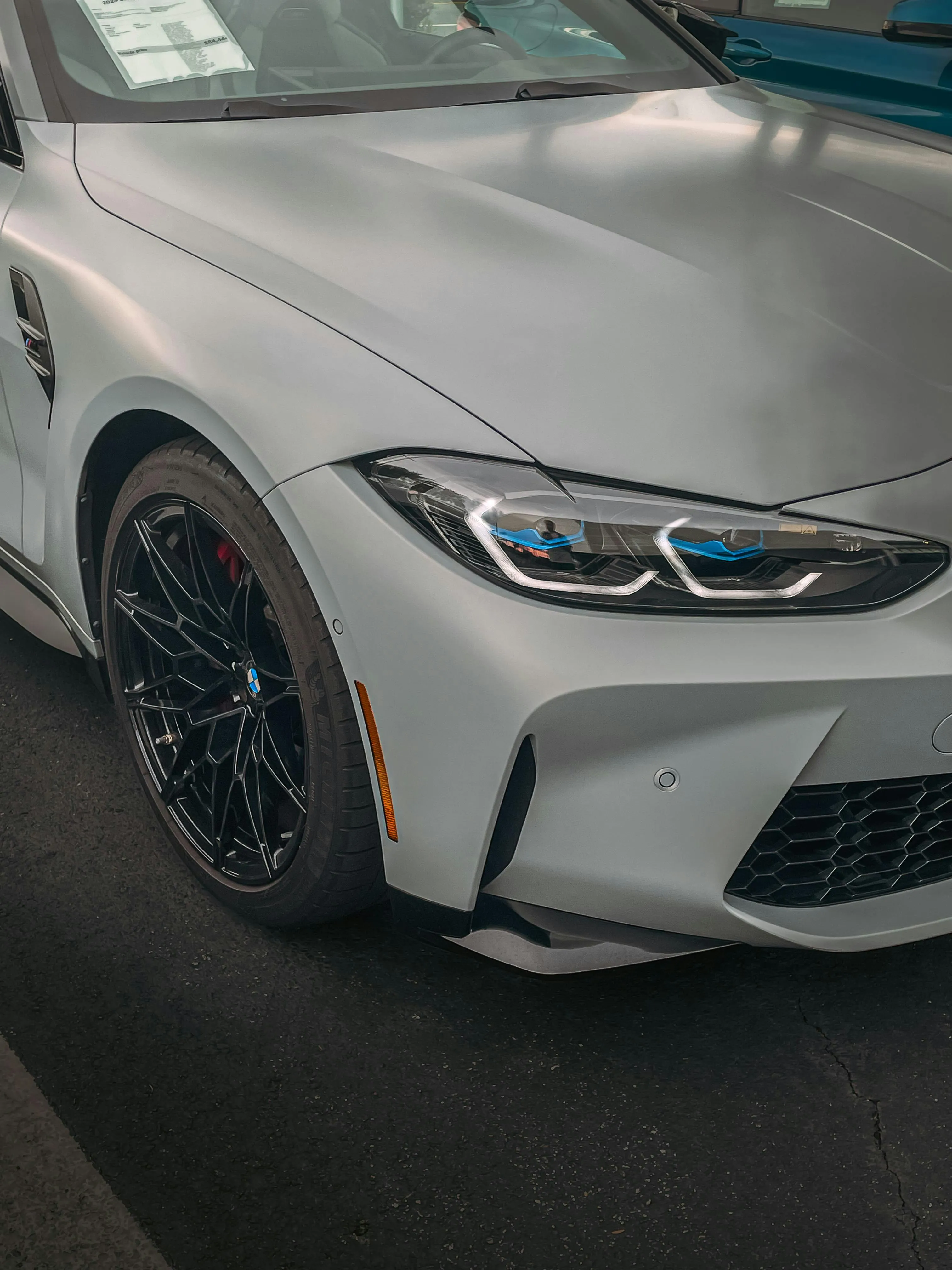 Bmw Closeup of Front Headlight and Sport Alloy Wheels