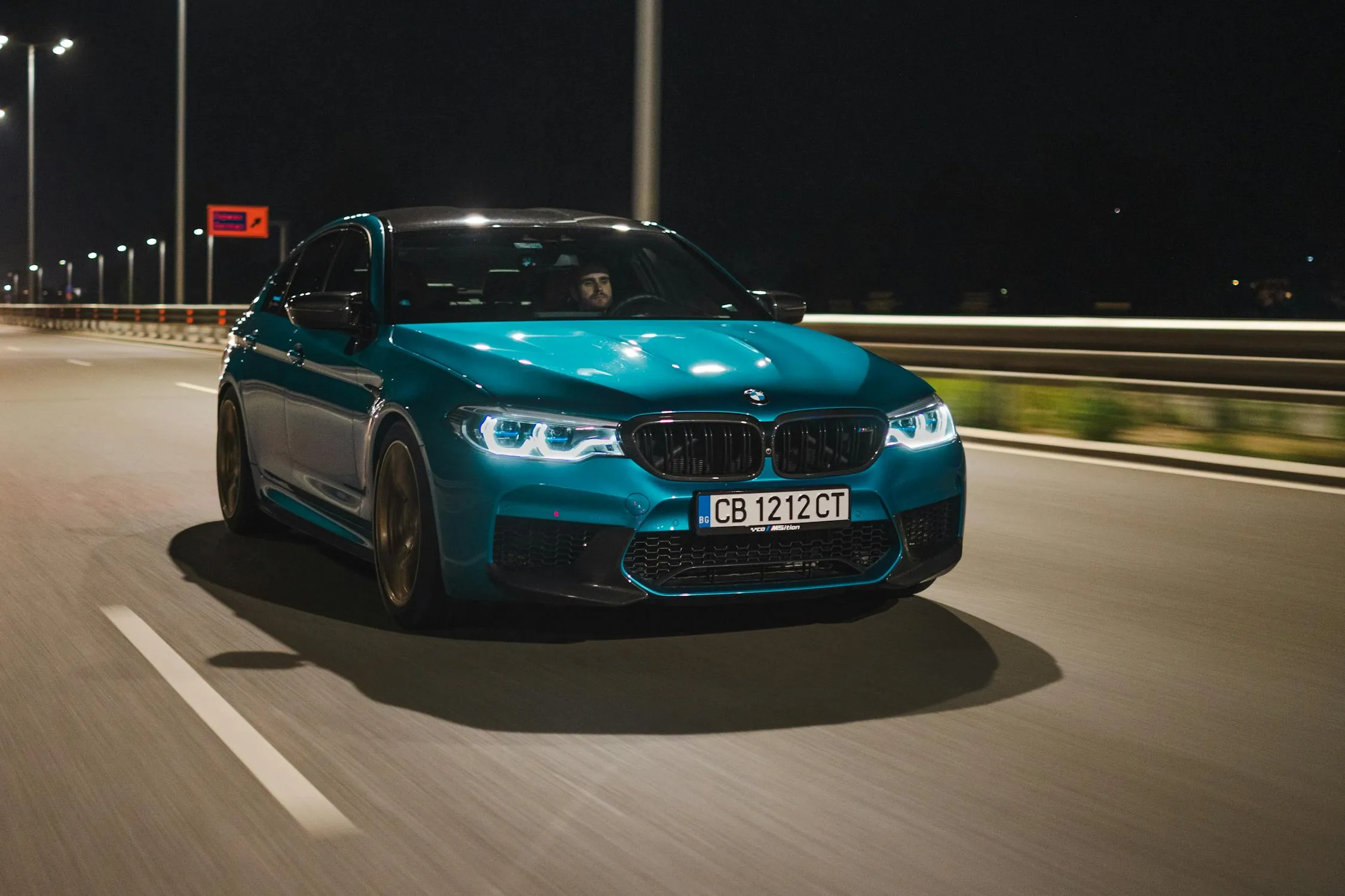 Bmw Convertible Driving Fast on a City Bridge at Night
