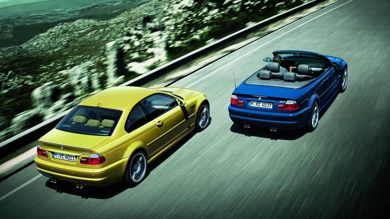 Bmw Convertible Driving on Scenic Open Road Wallpaper