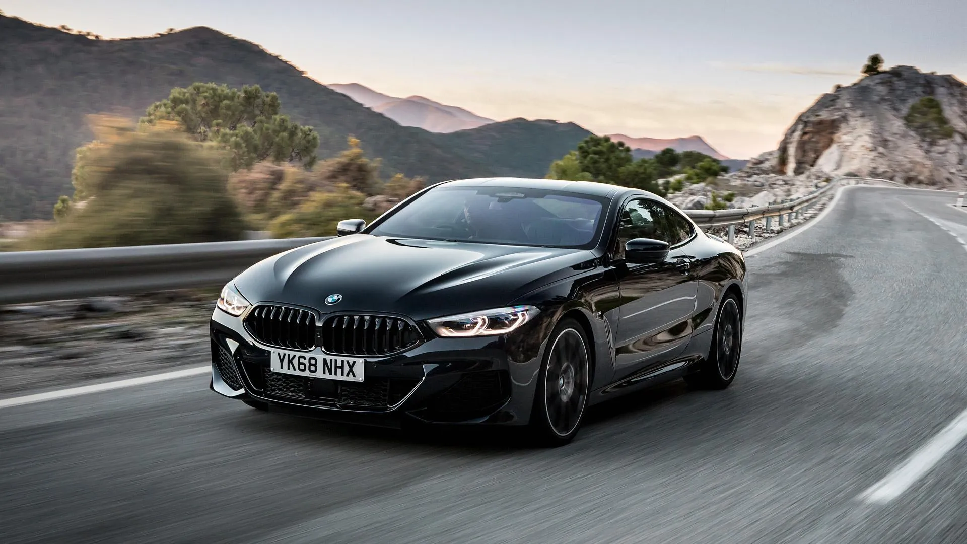 Bmw Coupe Navigating Tight Turns on Mountain Road Image