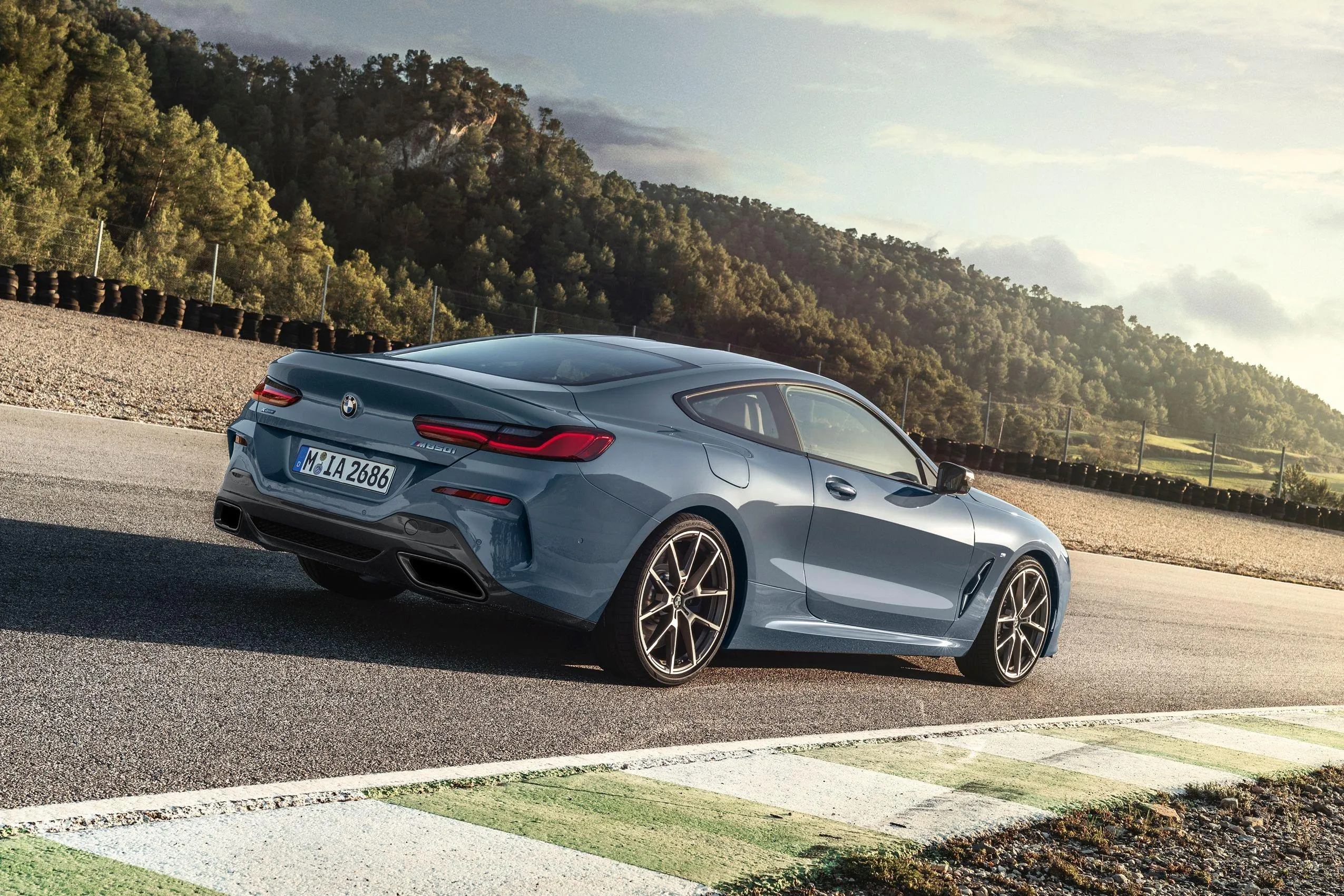 Bmw Coupe on Racetrack Near Mountains with Motion Blur