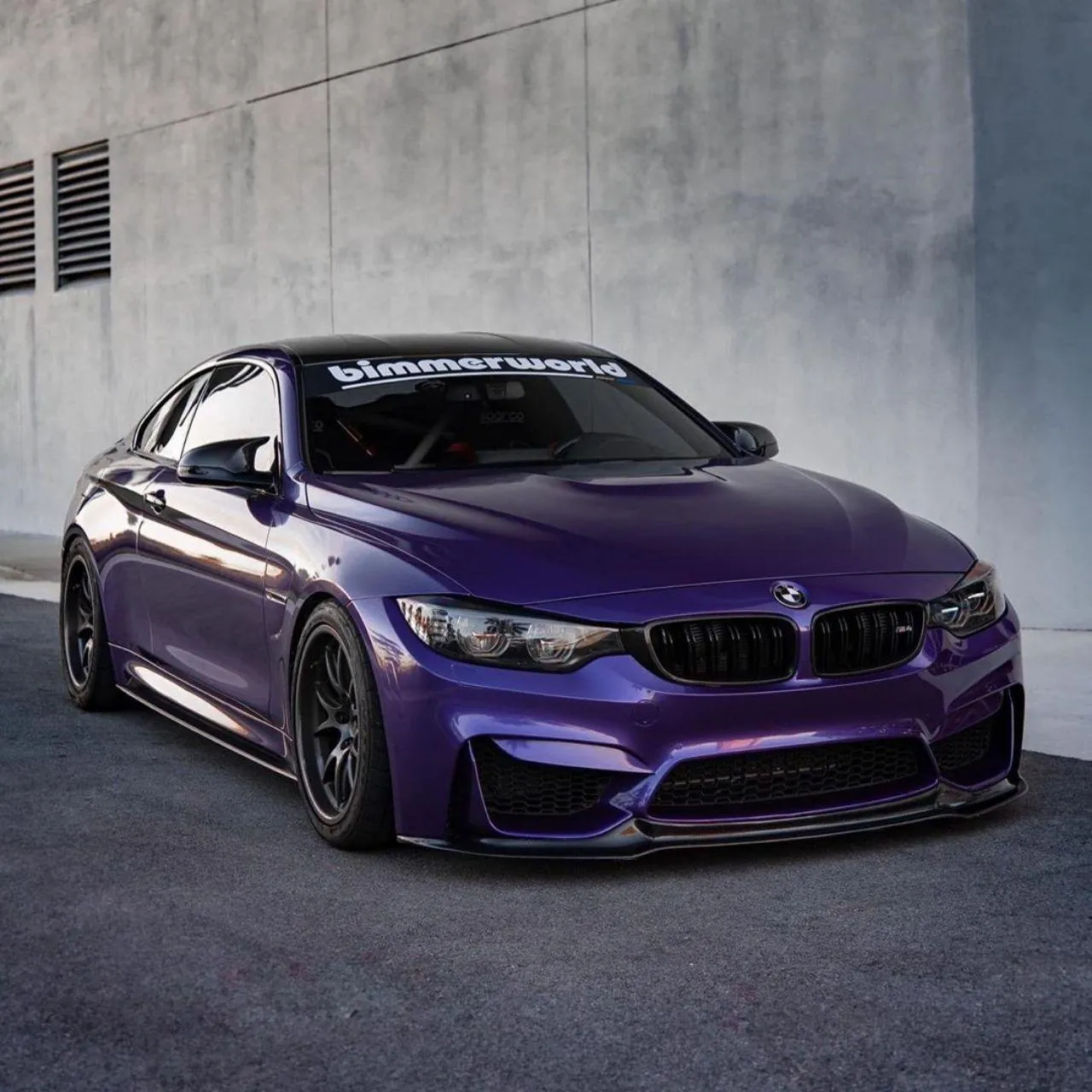 Bmw Coupe with Bold Purple Color on Urban Streets Wallpaper