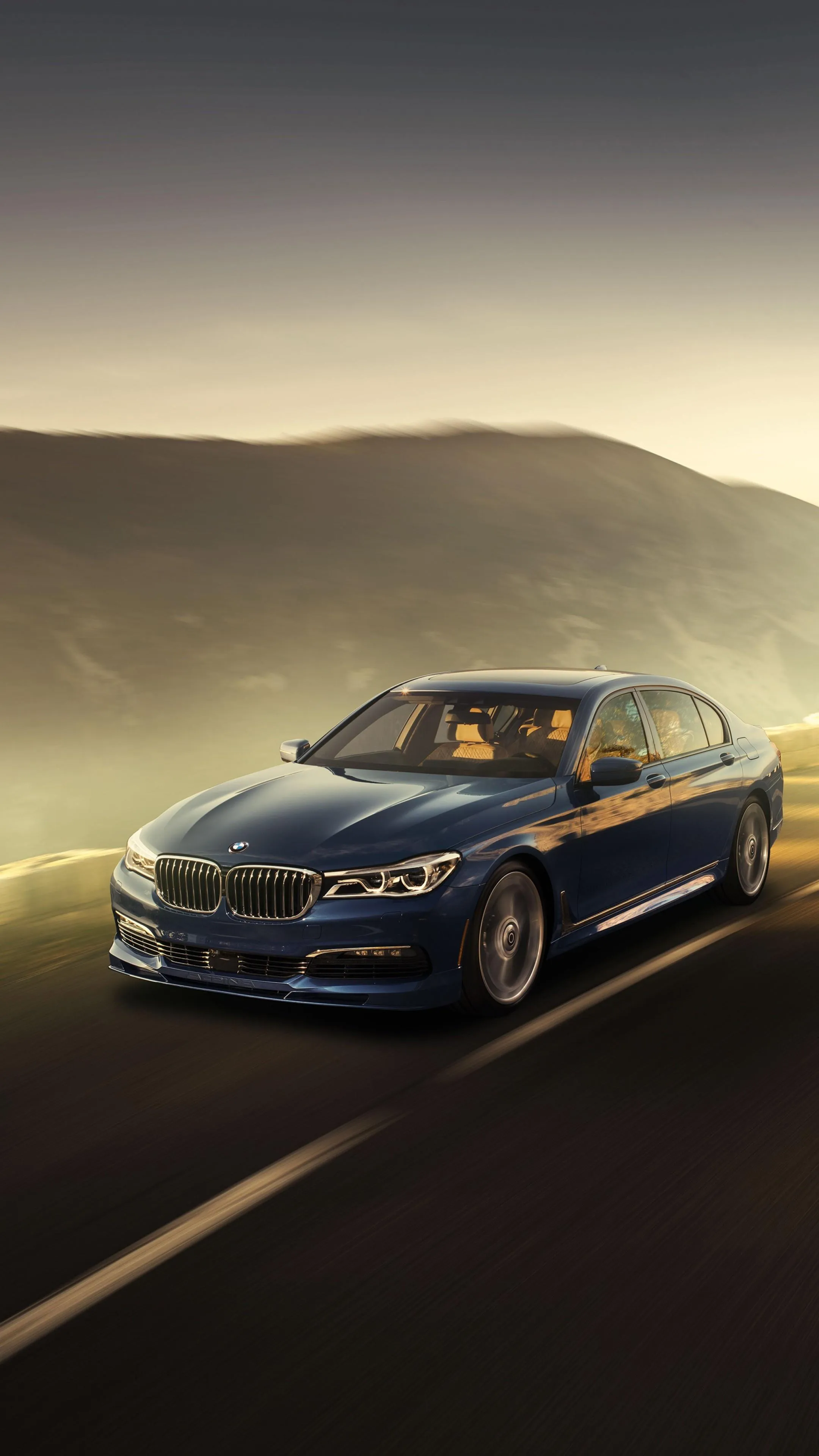 Bmw Driving Through Scenic Sunset with Warm Colours Hd
