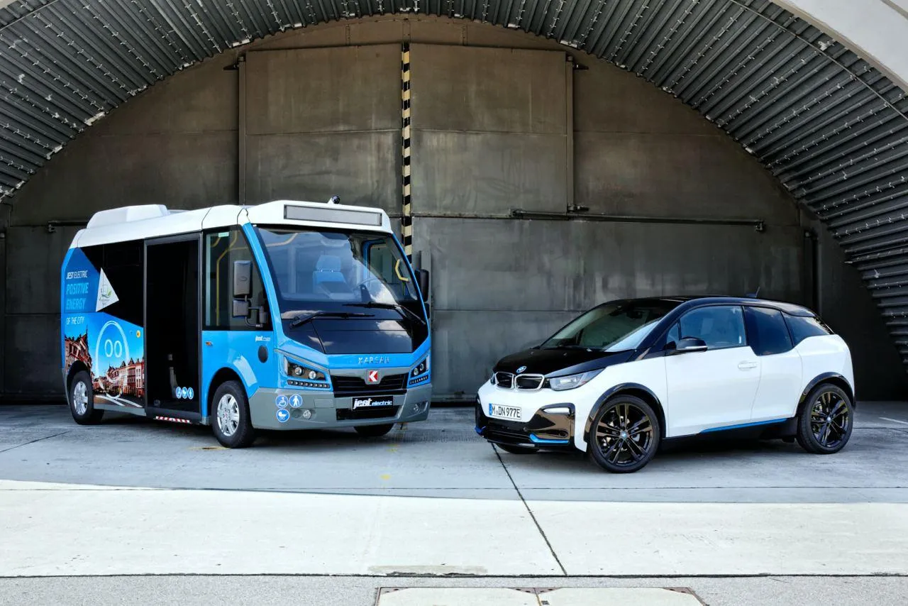 Bmw Electric Car and Bus Parked in Industrial Hangar Area