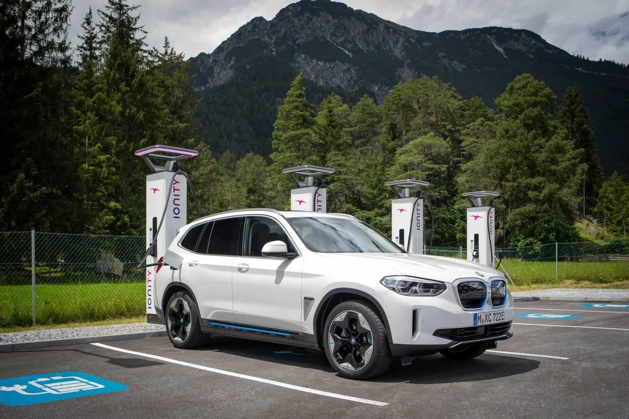 Bmw Electric Car Charging at Scenic Location Wallpaper