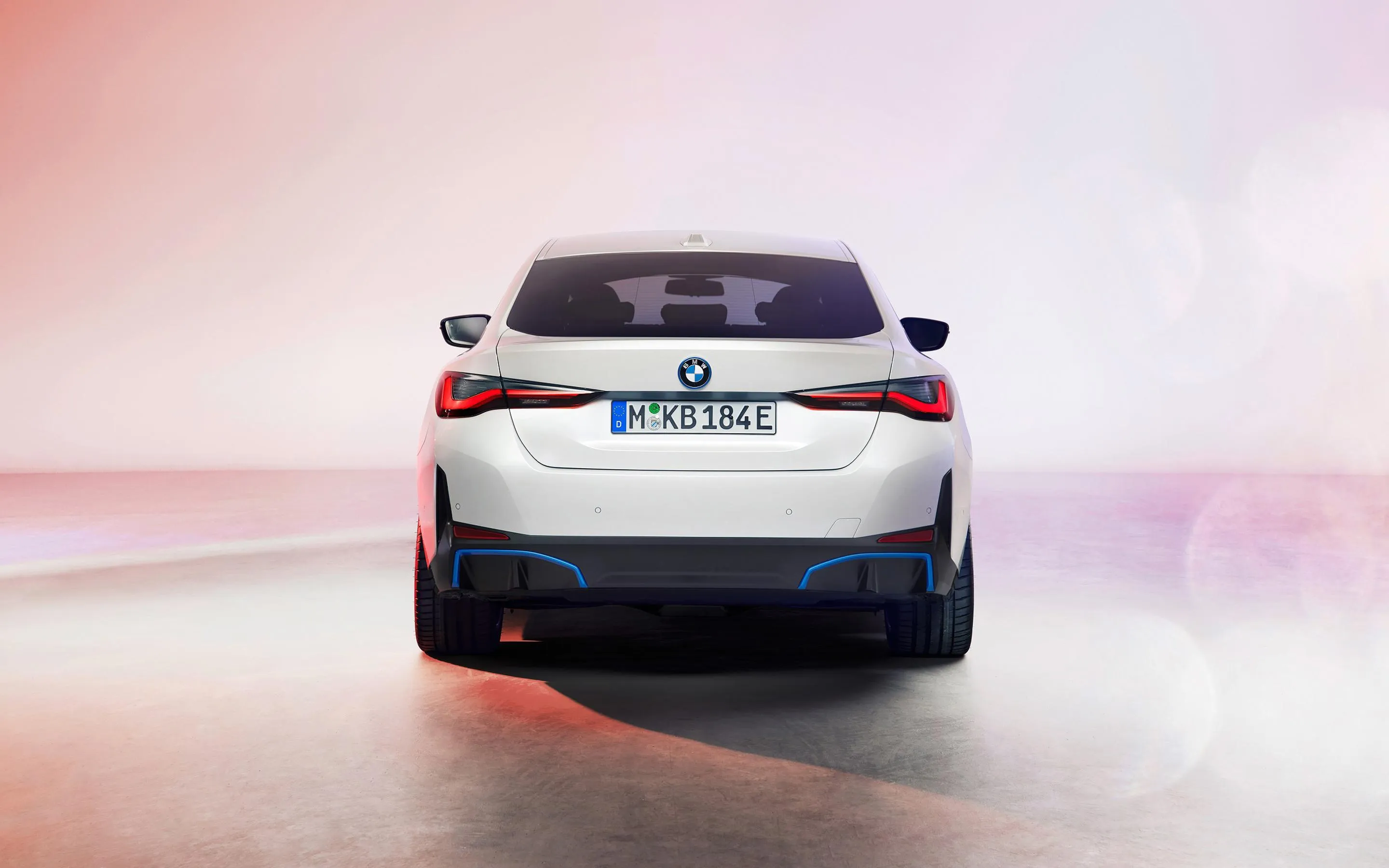 Bmw Electric Car Driving Through a Soft Colored Landscape