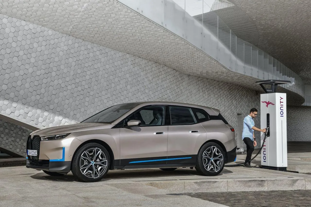 Bmw Electric Suv Charging at Station in Urban Setting