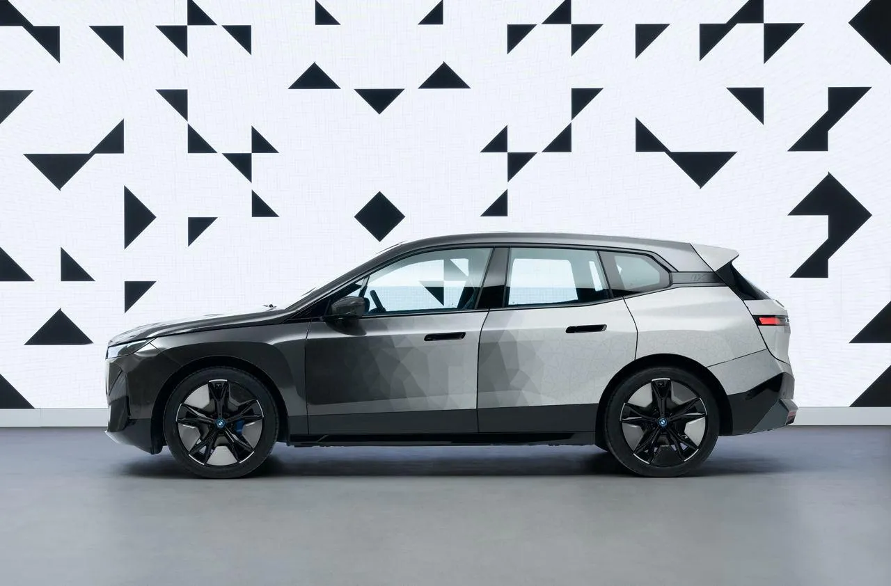Bmw Estate Car Parked Beside Abstract Wall Design Wallpaper