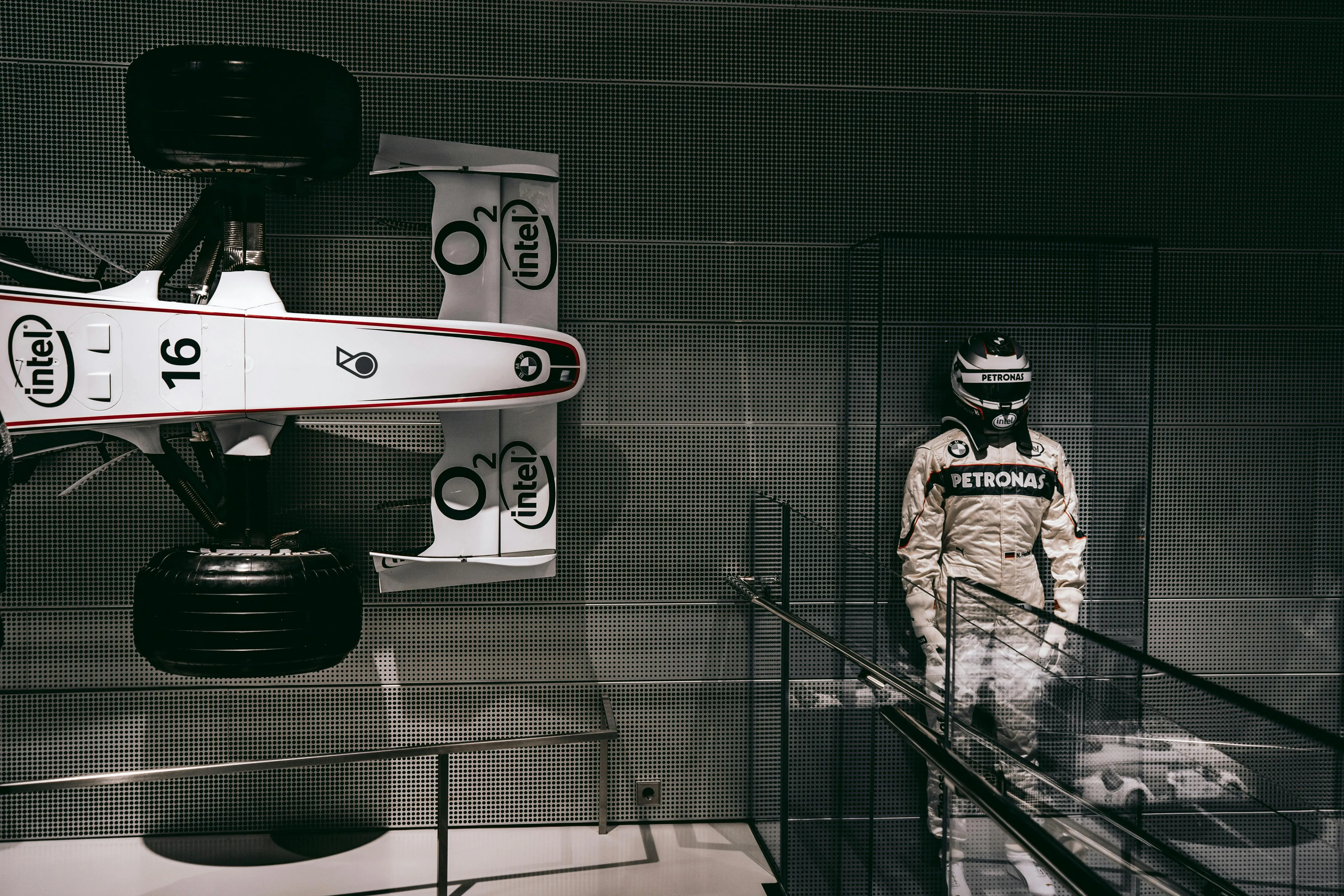 Bmw Formula One Car and Driver Suit Displayed Indoors