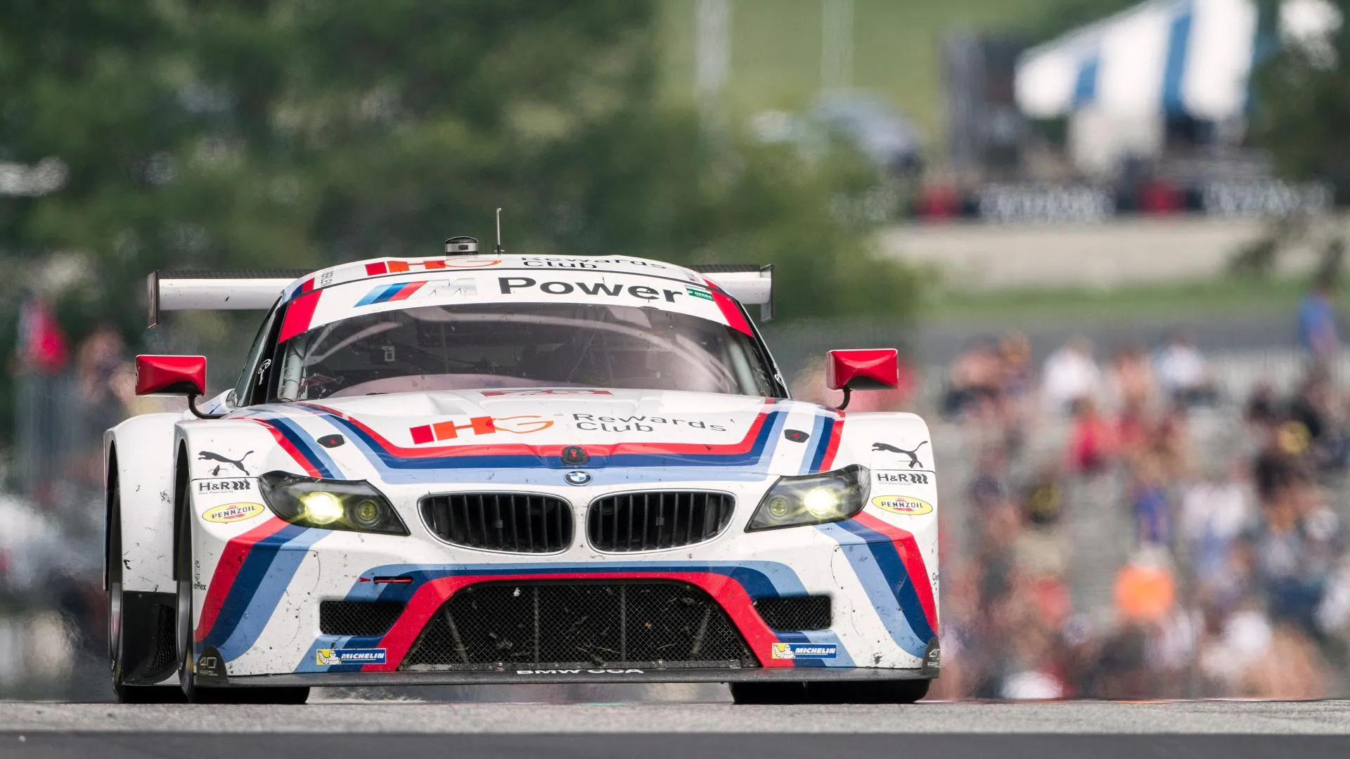 Bmw Gt3 Race Car Speeding Through the Circuit During the Race