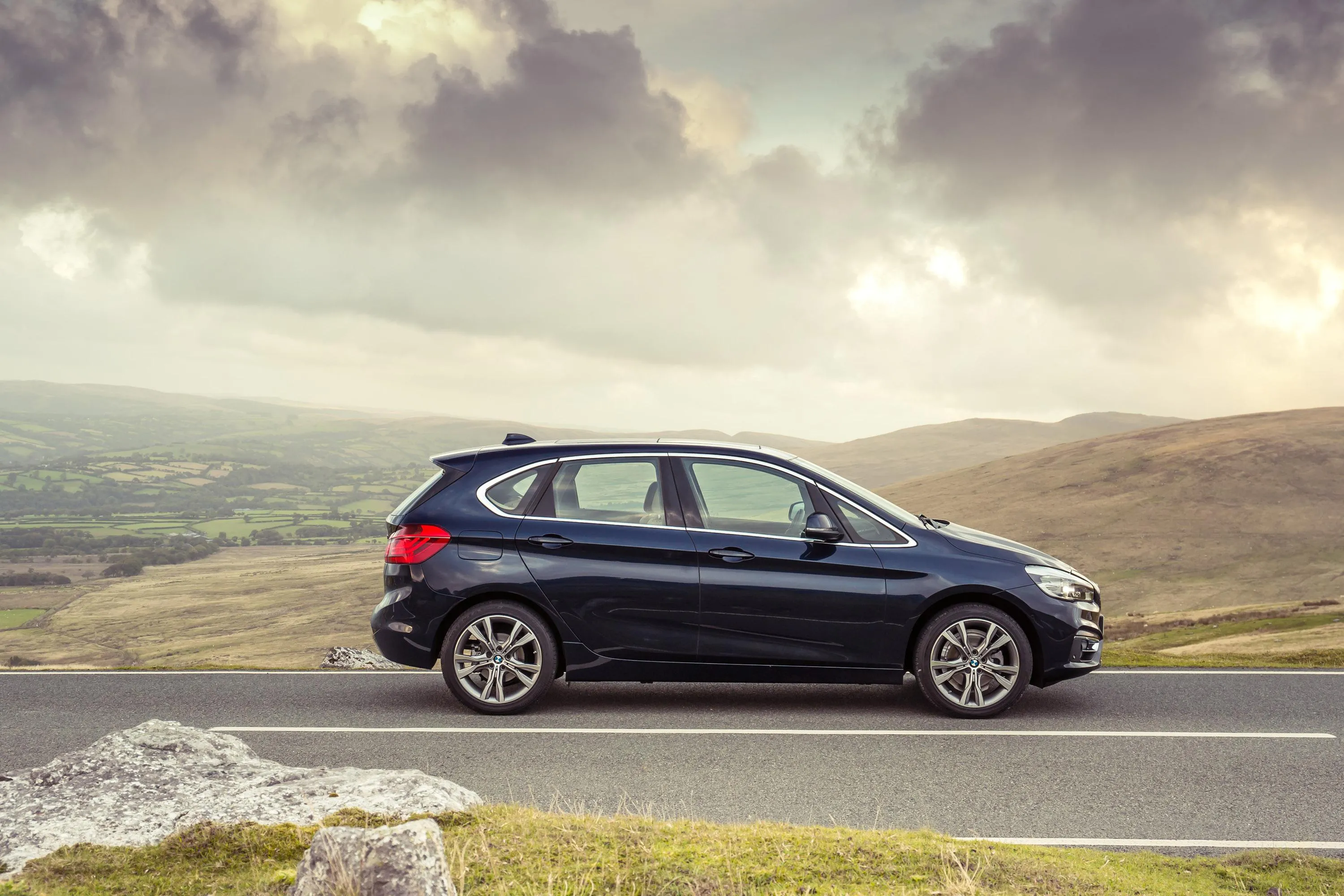 Bmw Hatchback Parked on Scenic Mountain Road Hd Image
