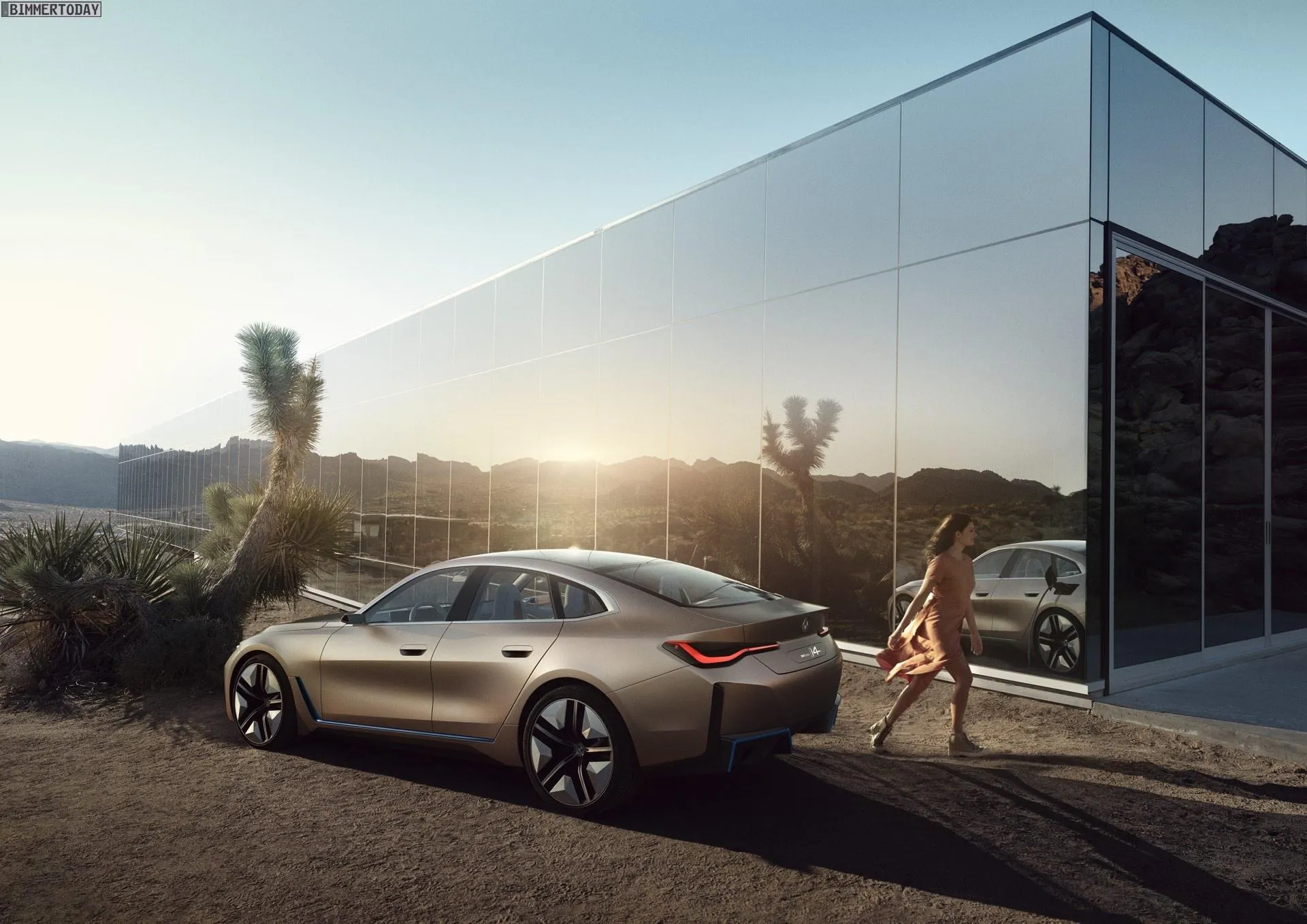 Bmw I Car Parked By Glass Building in Evening Sunlight