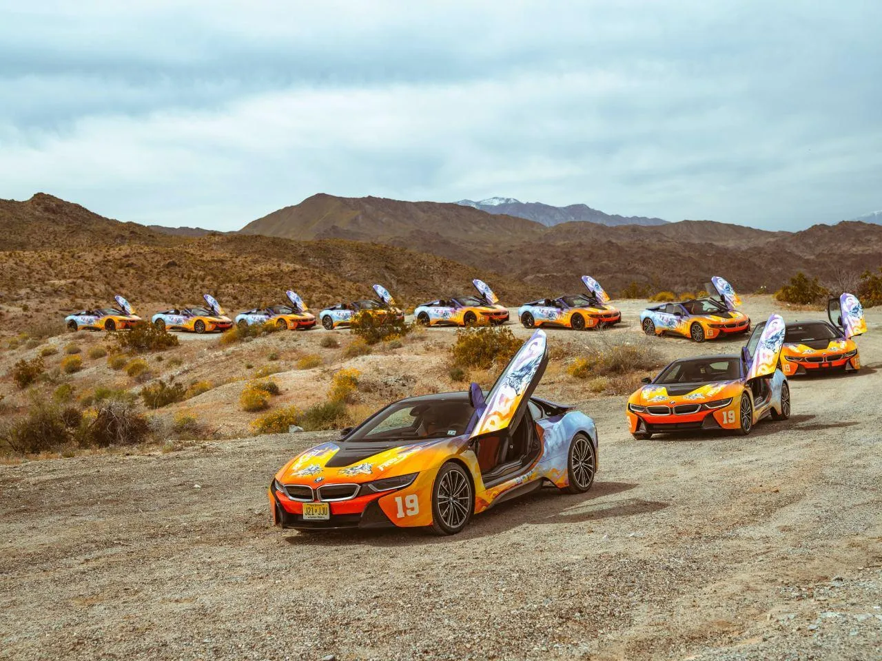 Bmw I Series Parked in a Desert with White Canopies